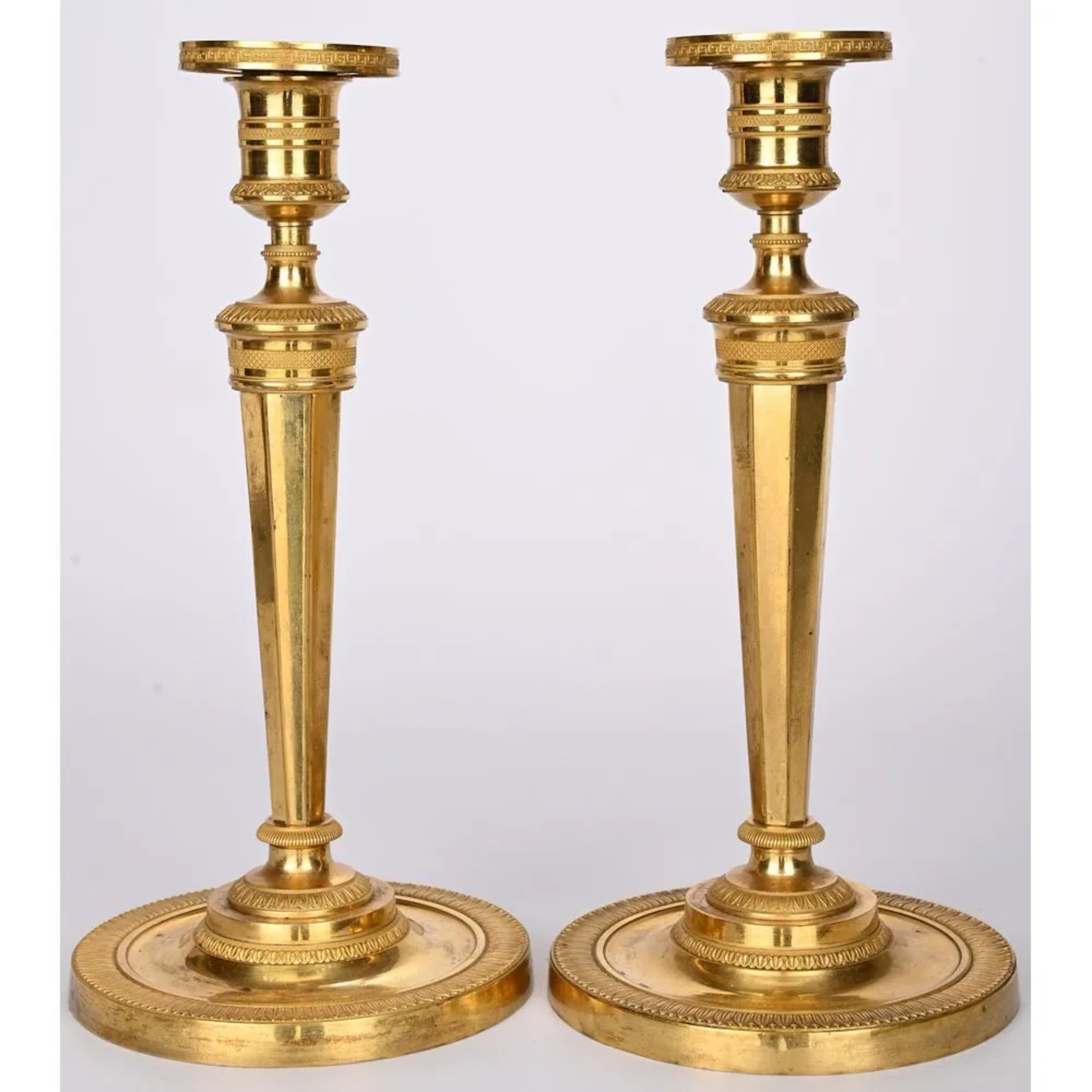 A BEAUTIFUL PAIR OF CONSULATE CANDLESTICKS based on a design by GALLE