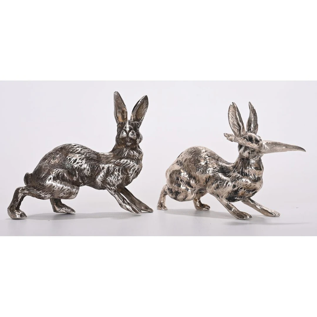 2 solid silver hares hallmarked with Minerva, one with a carrot. Weight:
