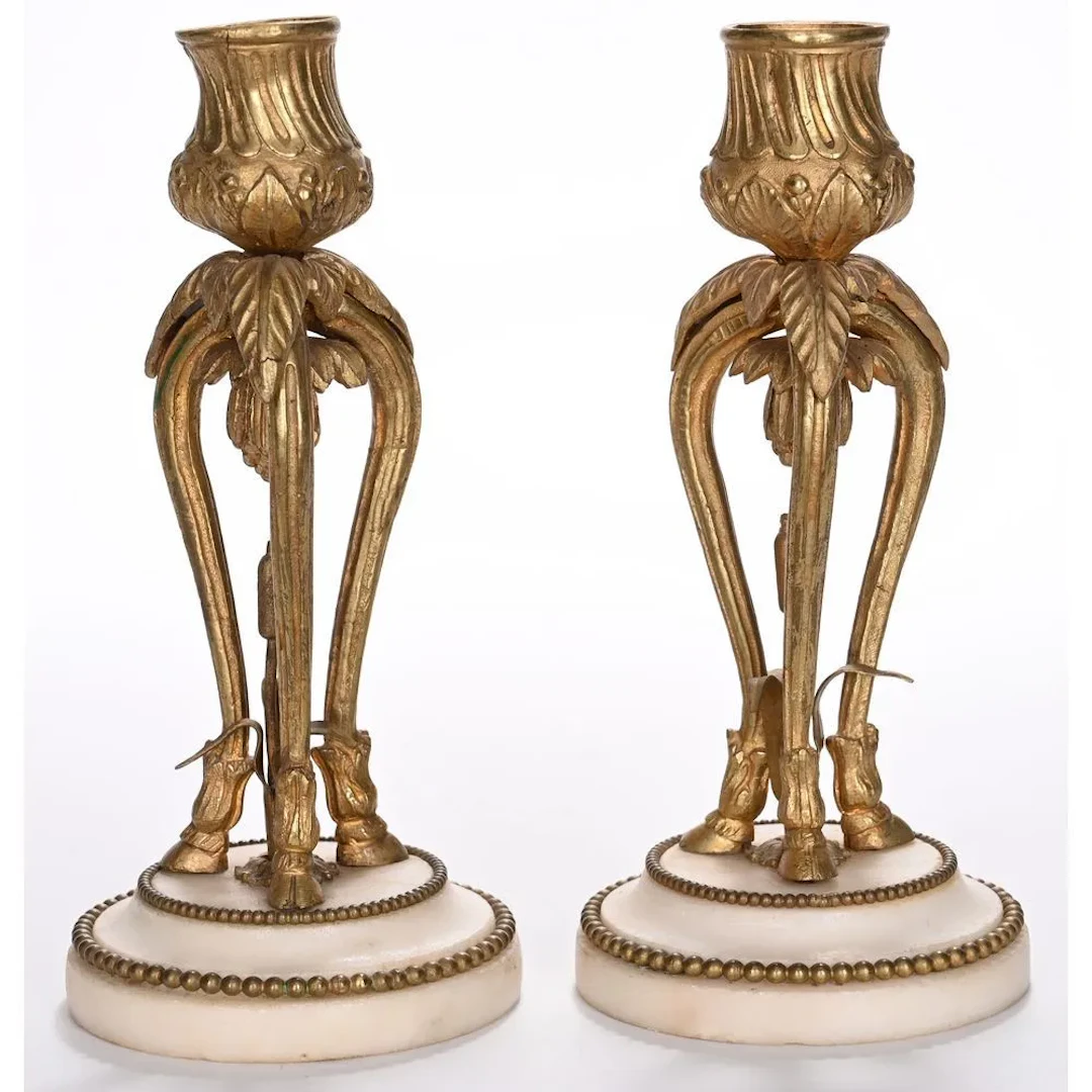 PAIR OF SMALL LOUIS XVI CANDLESTICKS in gilded bronze and white marble