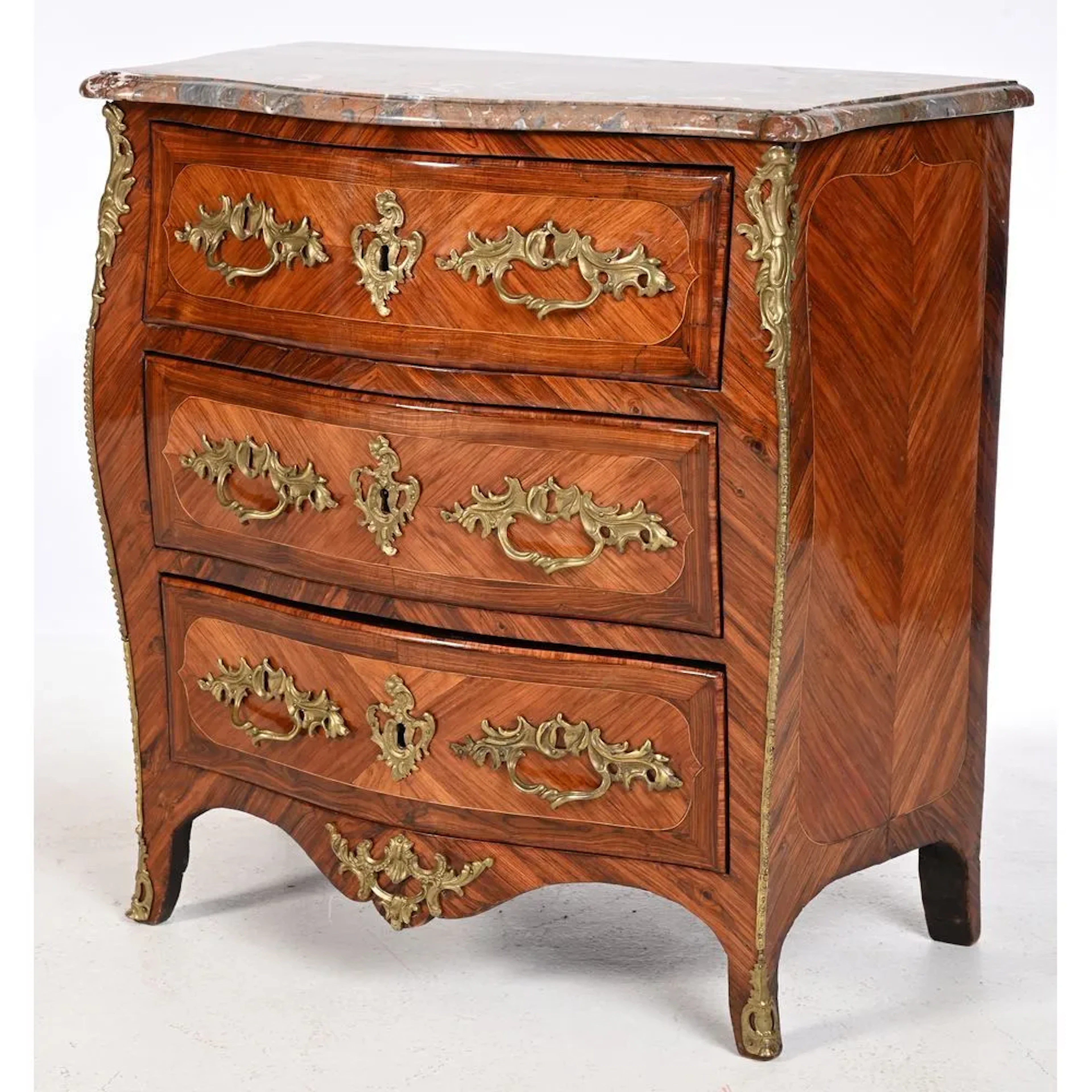LARDIN. SMALL LOUIS XV CHEST OF DRAWERS with a curved front and sides