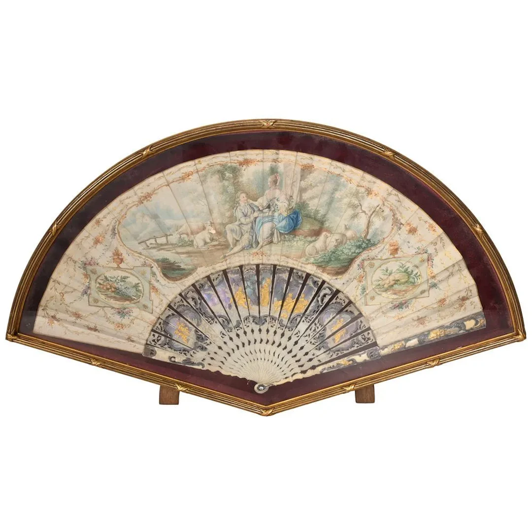 LOUIS XVI FAN decorated with a pastoral and romantic scene in a park.