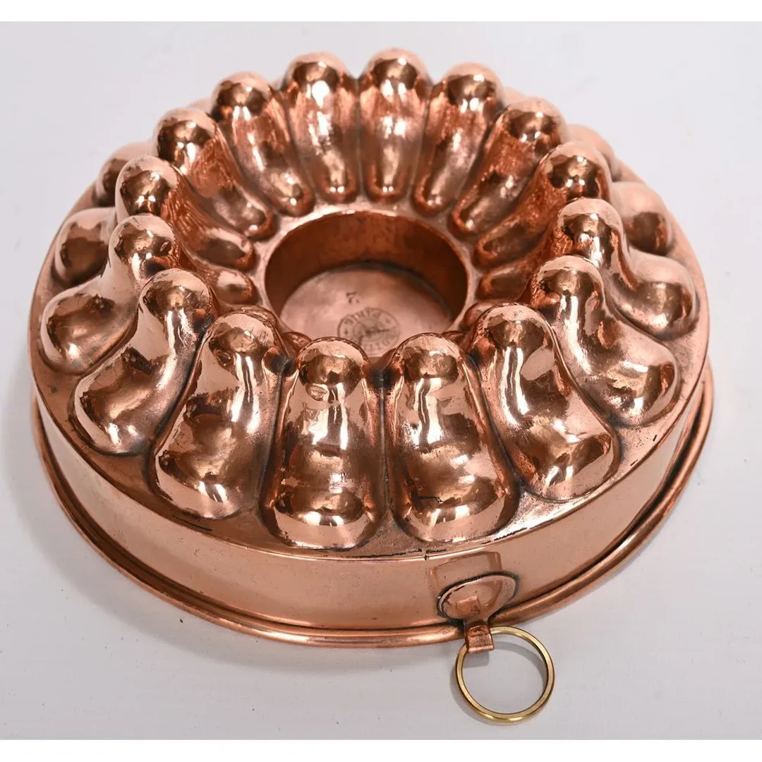 TROTTIER, PARIS. ORIGINAL copper flan mold with curved gadroons. Hanging