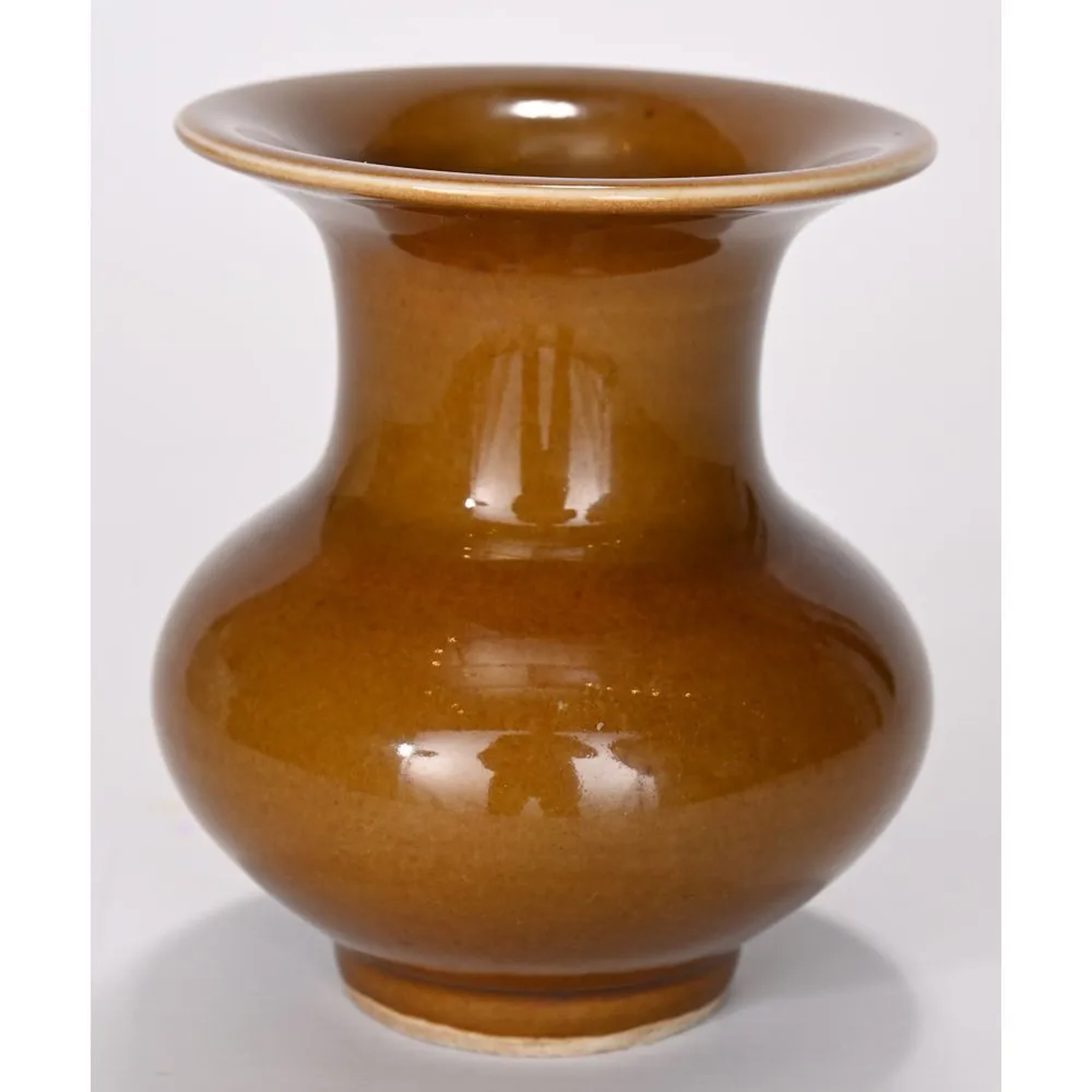 SMALL VASE made of Chinese porcelain with ochre glaze. Six-character