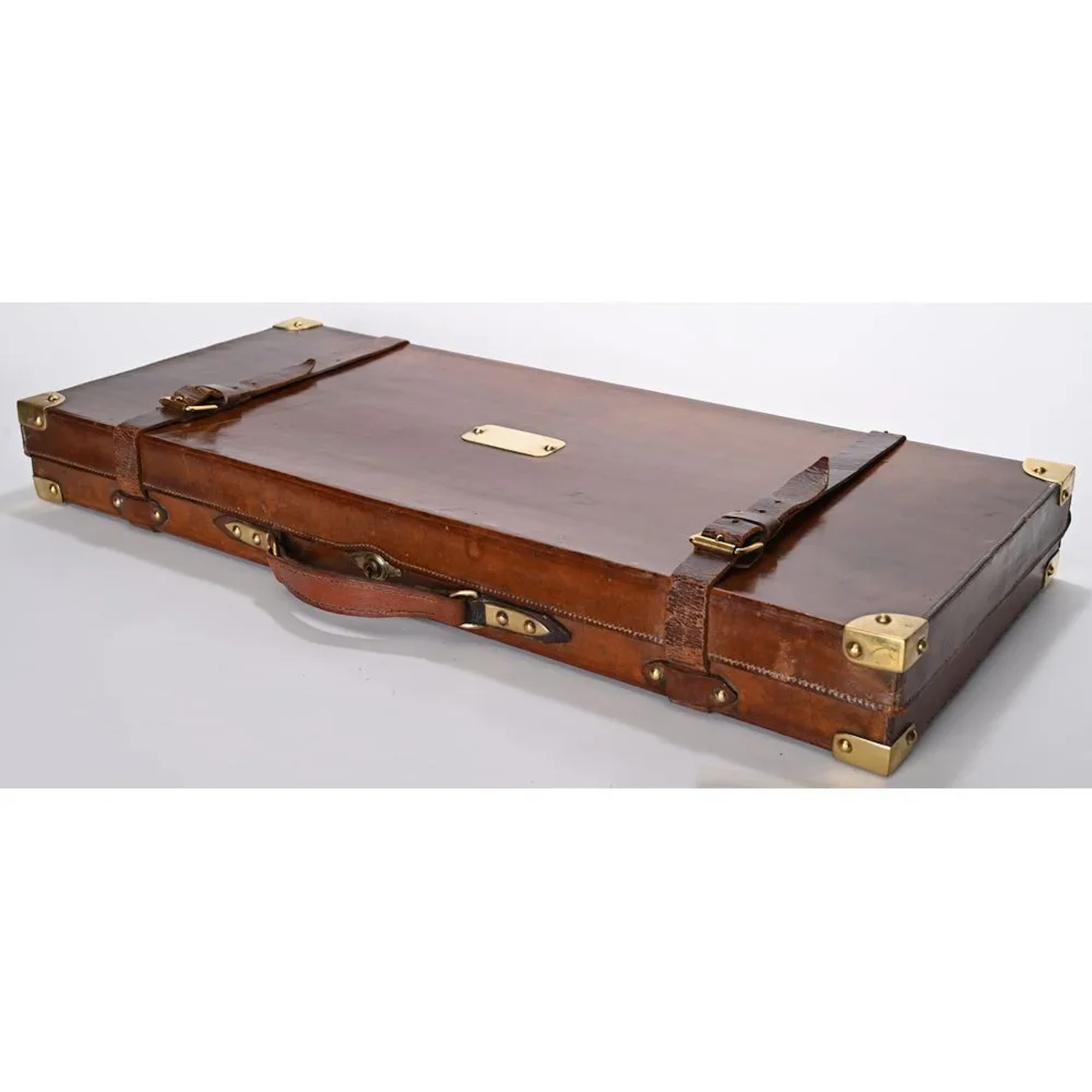 Leather case for a pair of rifles with brass corner fittings. H.9 L.77 P.33.