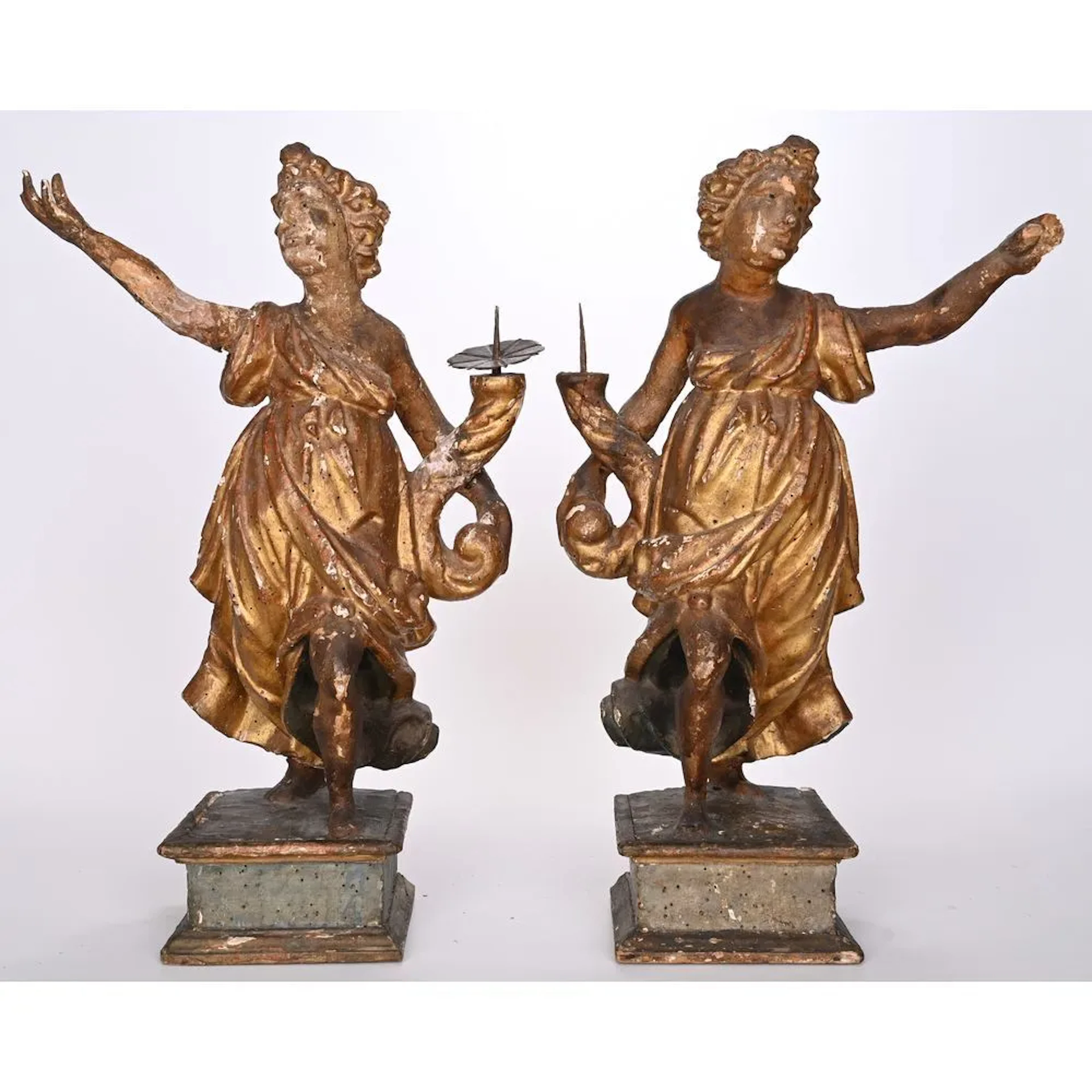 PAIR OF POLYCHROME WOODEN CANDLESTICK ANGELS. They are depicted standing