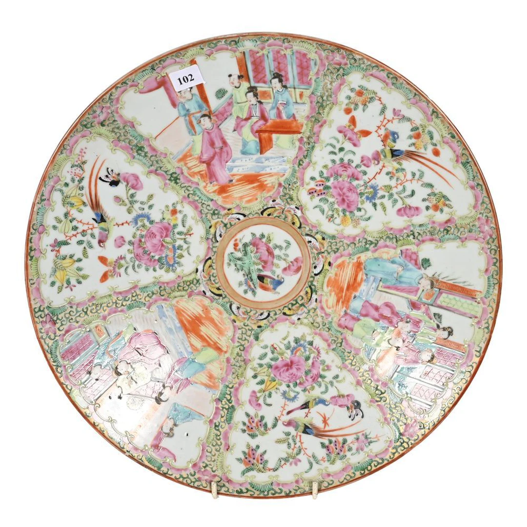 CHINA. Polychrome porcelain plate decorated with lively scenes featuring