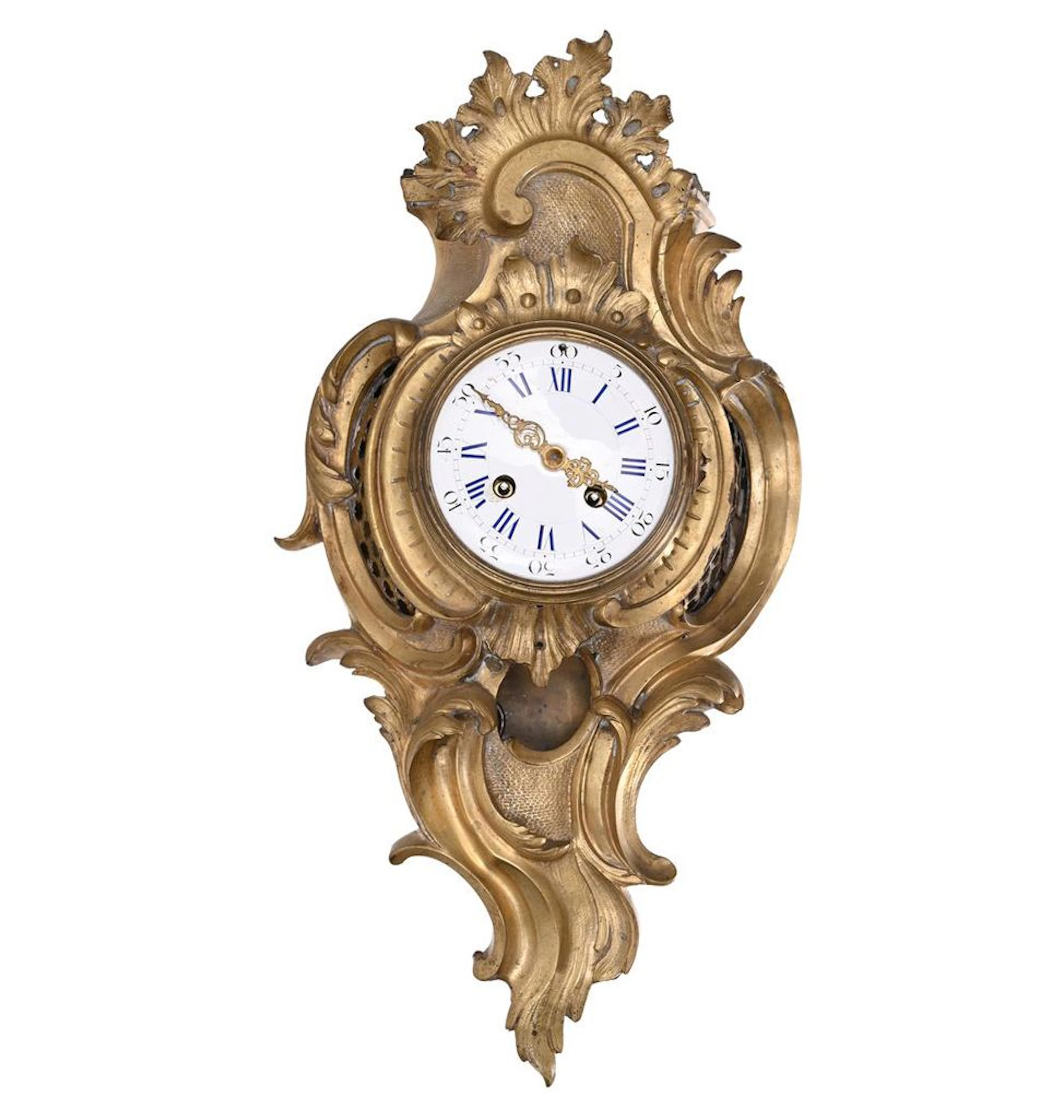 LOUIS XV CARTEL in gilded bronze with molded and sculpted foliage