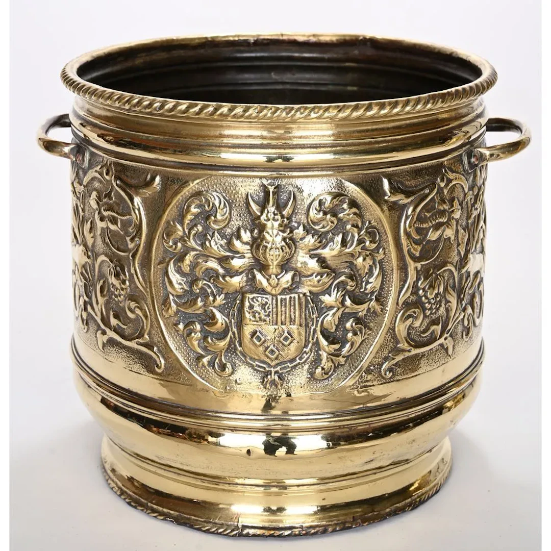 Kitchen utensil made of chiseled yellow copper, decorated with animals