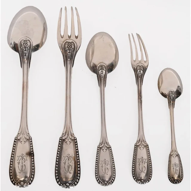 Sterling silver cutlery set, hallmarked with Minerva, featuring foliage