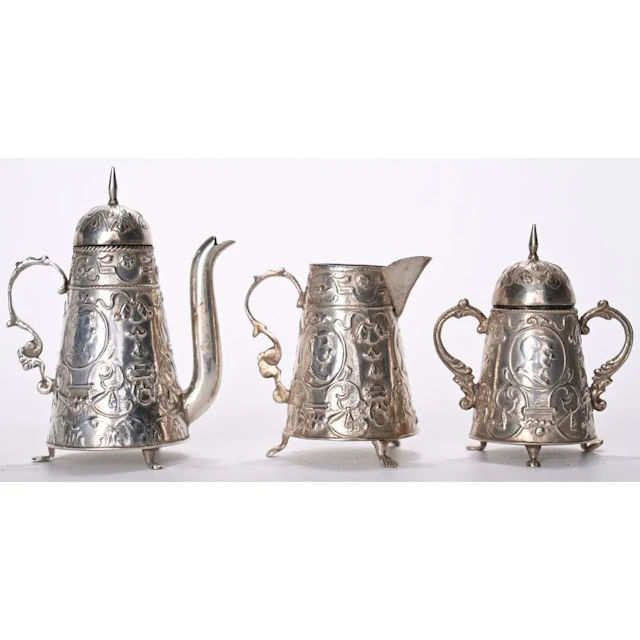 ORIGINAL SMALL SILVER DOLL SET. Russian work, circa 1900. H.7.