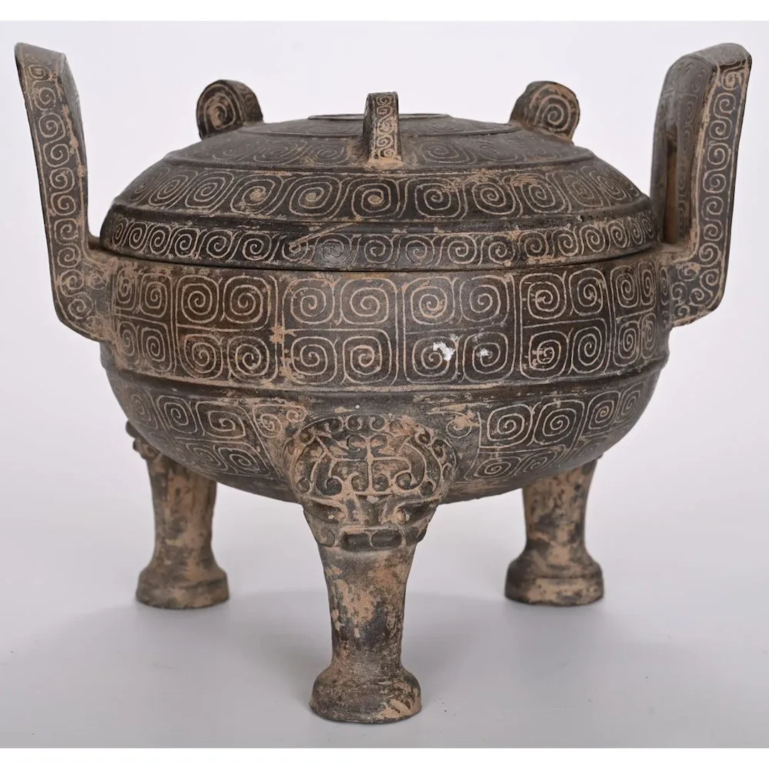 Rare ritual three-legged cauldron of the gui type. Gray terracotta