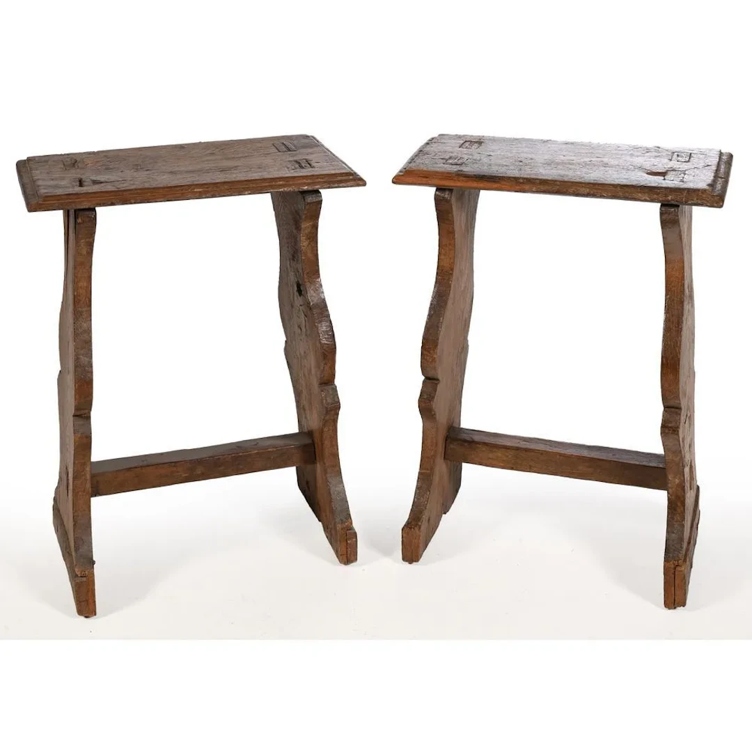 PAIR OF LOUIS XIII CHANTRE STOOLS in weathered oak. The legs are scroll-shaped.