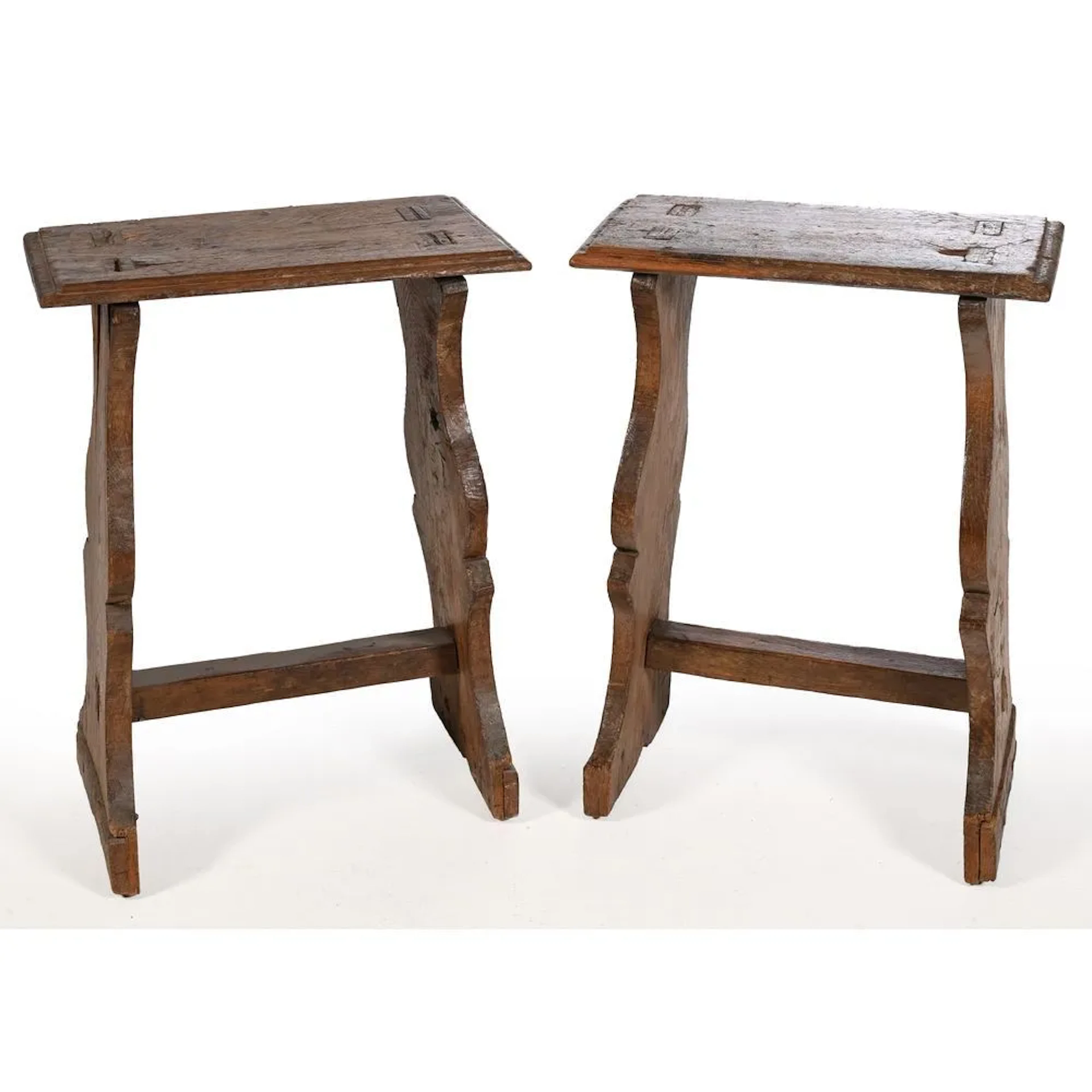 PAIR OF LOUIS XIII CHANTRE STOOLS in weathered oak. The legs are scroll-shaped.