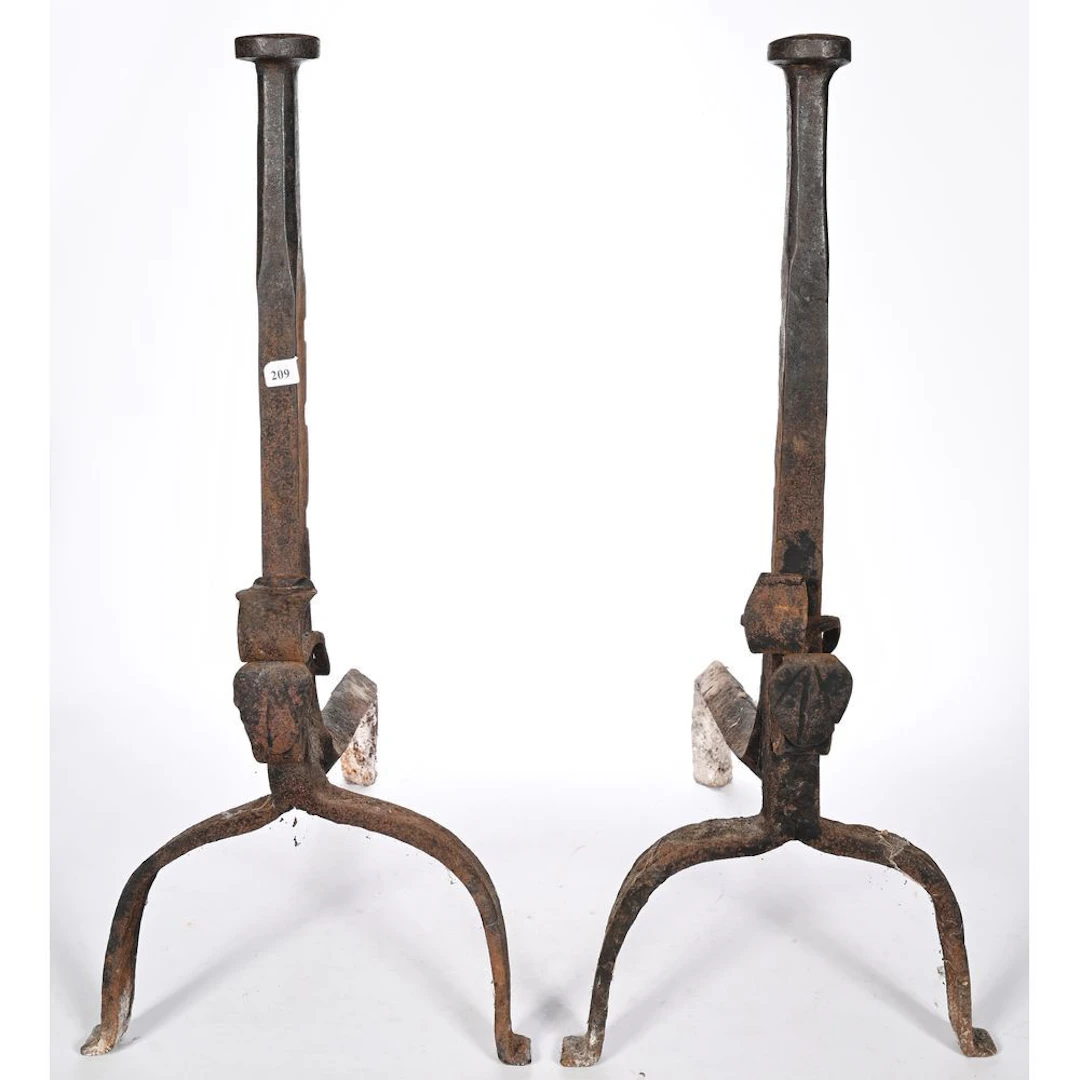 PAIR OF CAST-IRON LANDIERS with arched bases. Baluster shafts. (Antique