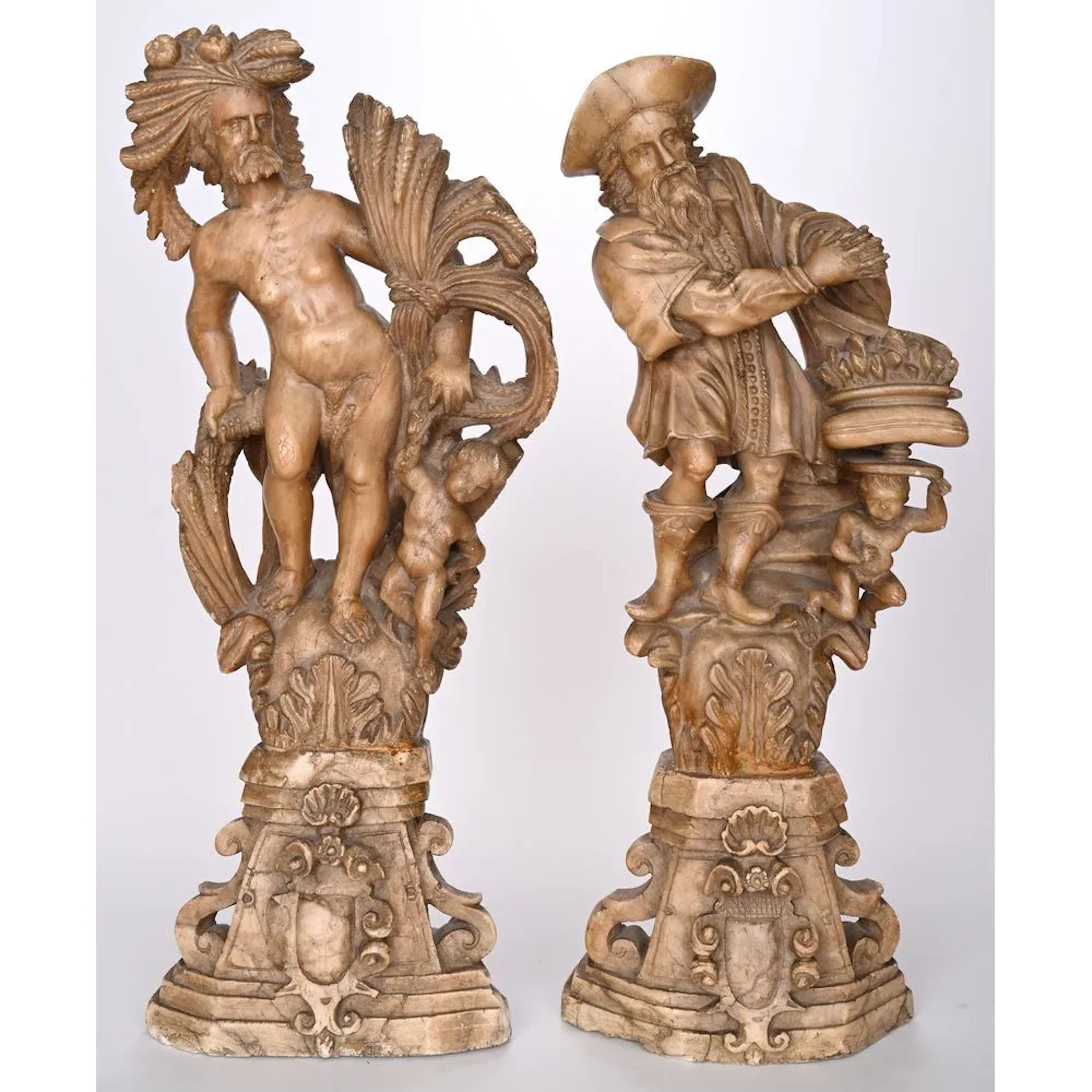 PAIR OF LARGE ALBASTRE SCULPTURES depicting summer and winter, illustrated