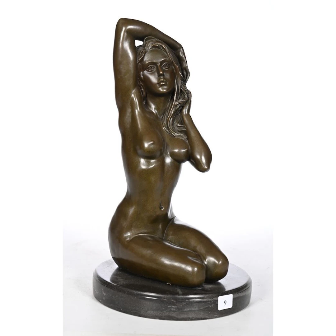 MANOLLO. “Seated Young Woman.” Bronze with a brown patina. Marble