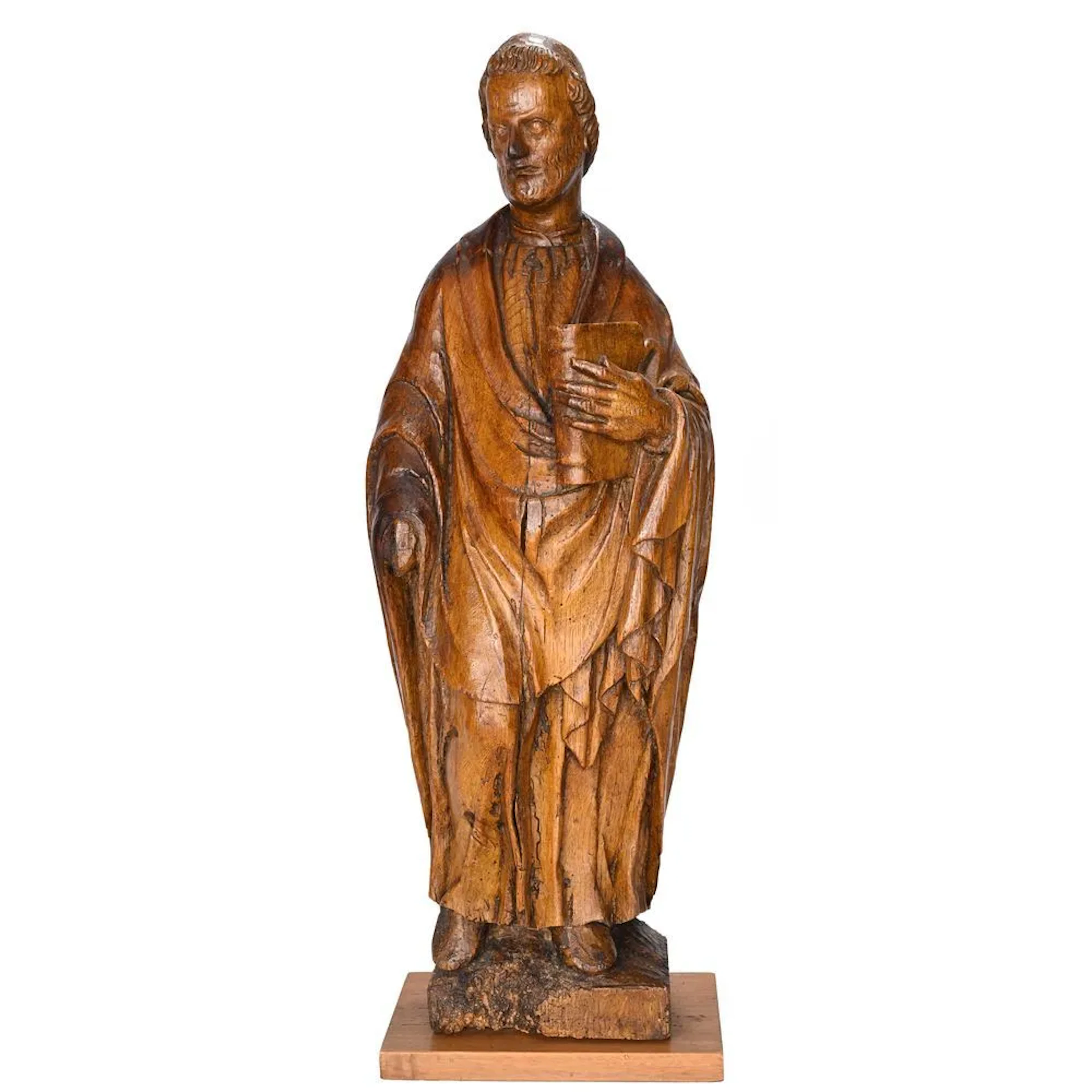 Carved wooden figure depicting an evangelist. (Signs of wear and damage).