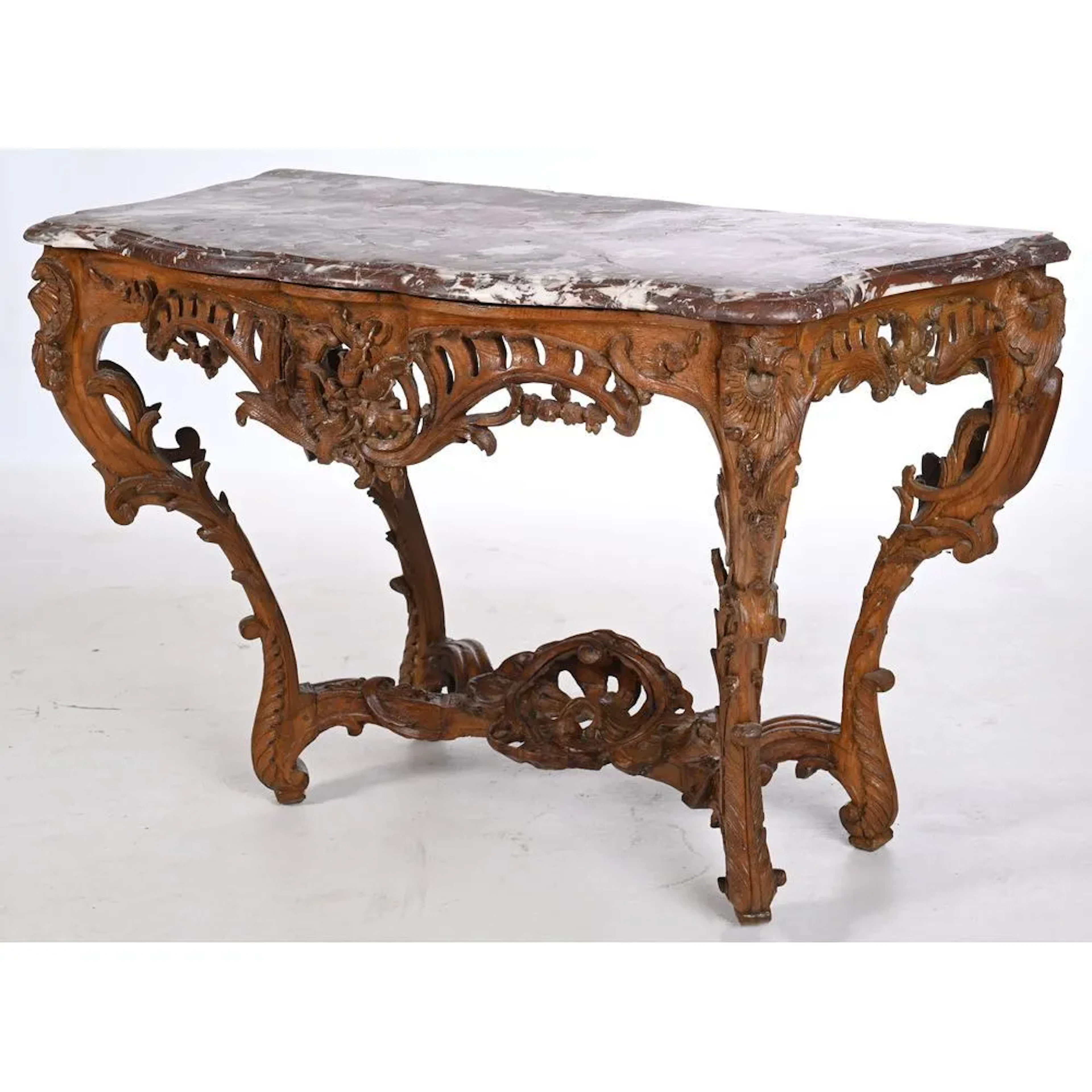 LOUIS XV CONSOLE in patinated oak. It stands on 4 legs. It is richly