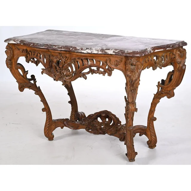 LOUIS XV CONSOLE in patinated oak. It stands on 4 legs. It is richly