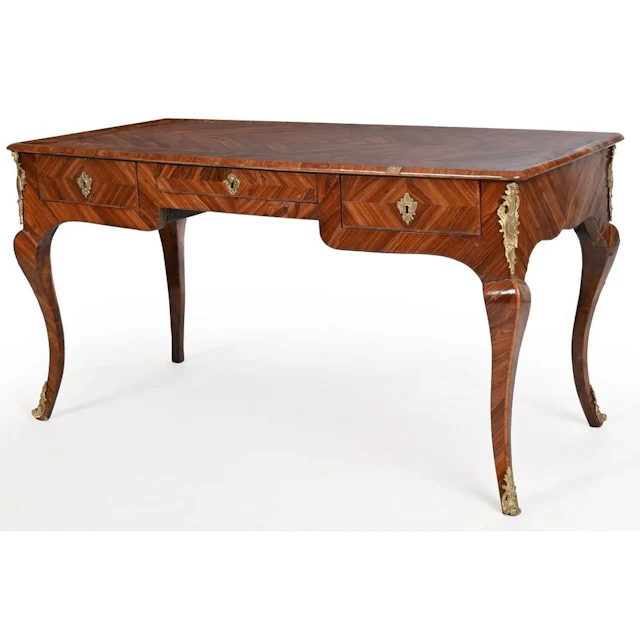 A LOUIS XV FLAT DESK with an undulating shape, made of rosewood and