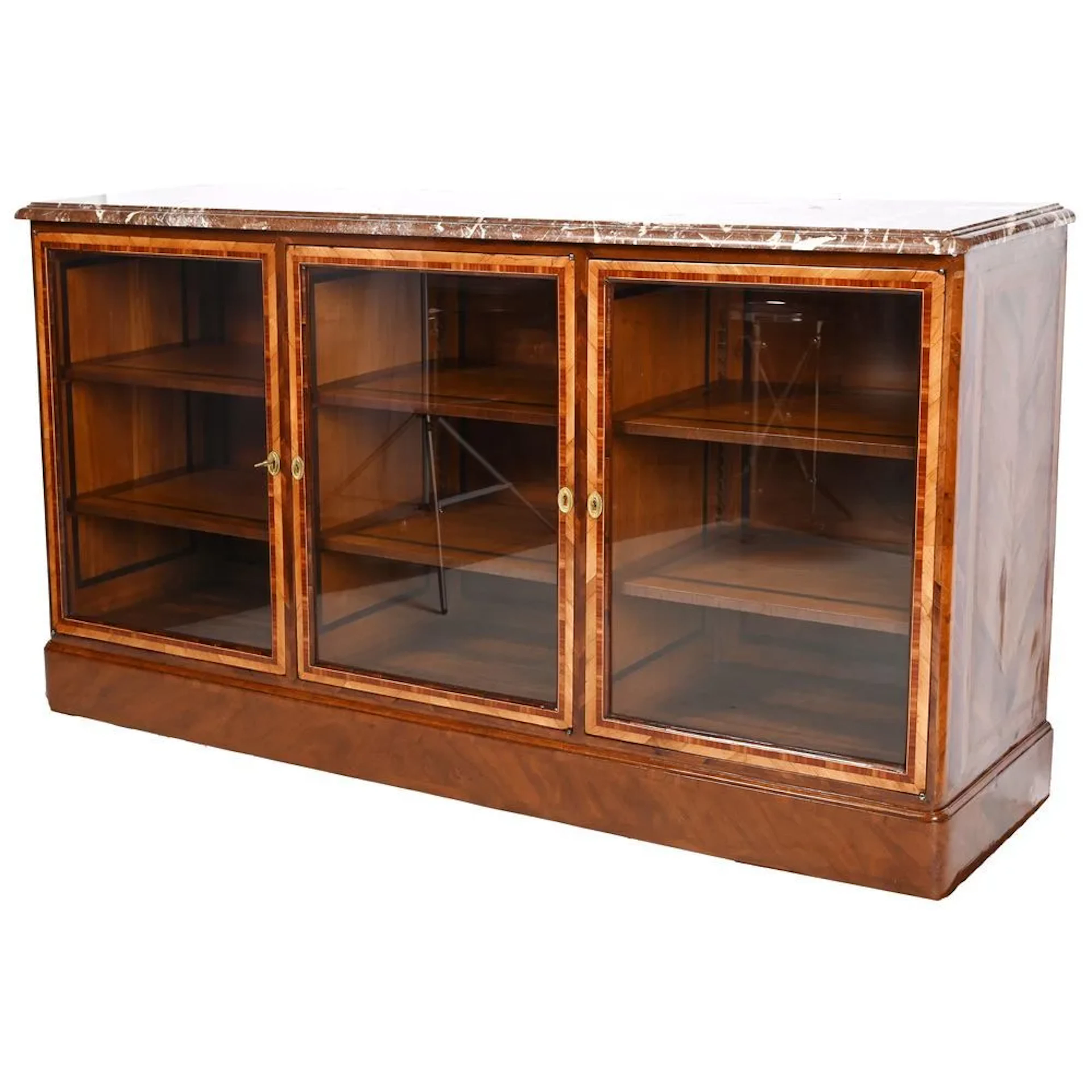 REGENCE BOOKCASE on a plinth at counter height, made of rosewood and