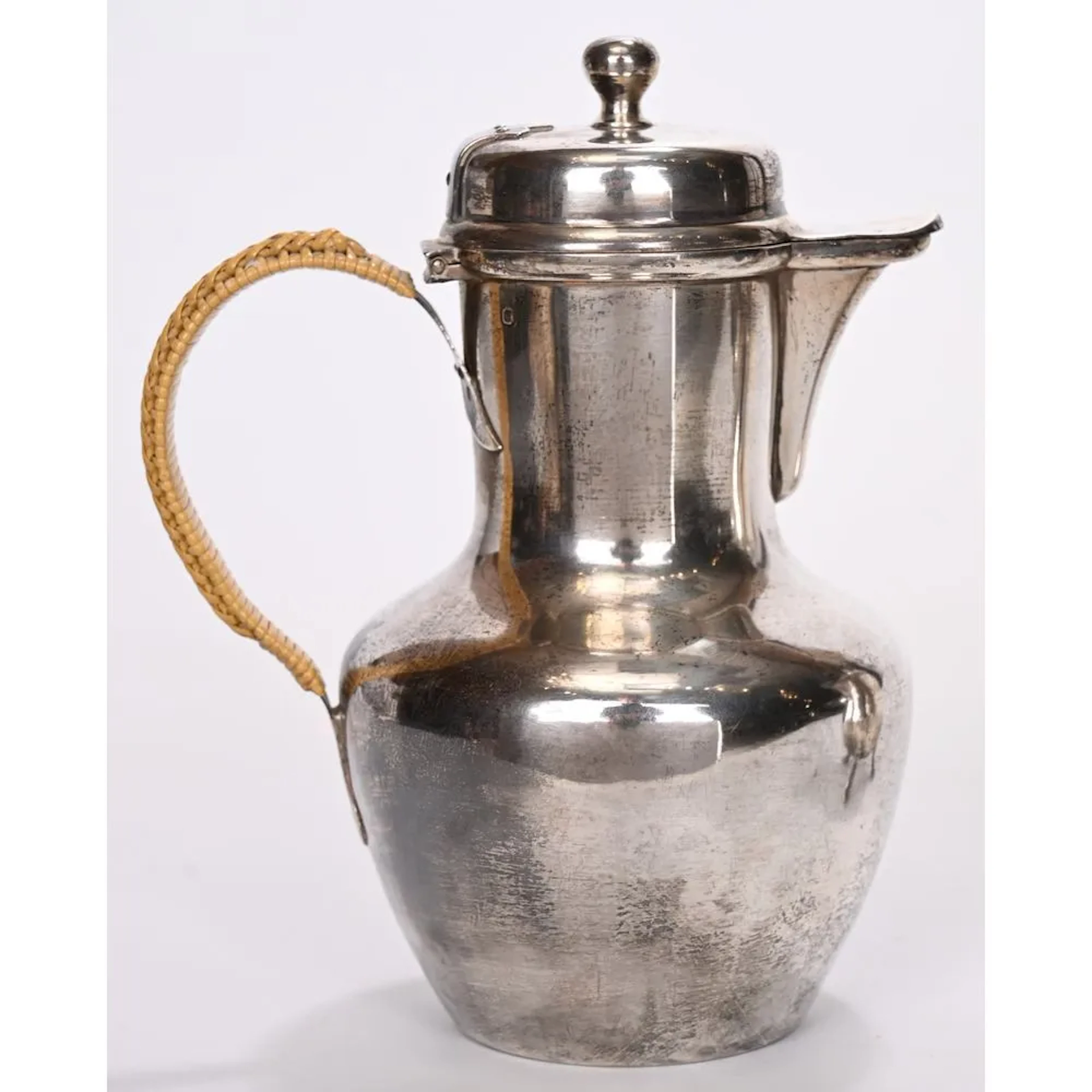 Plain silver pitcher. Duck-shaped spout. Wicker handle. PB. 292 grams.