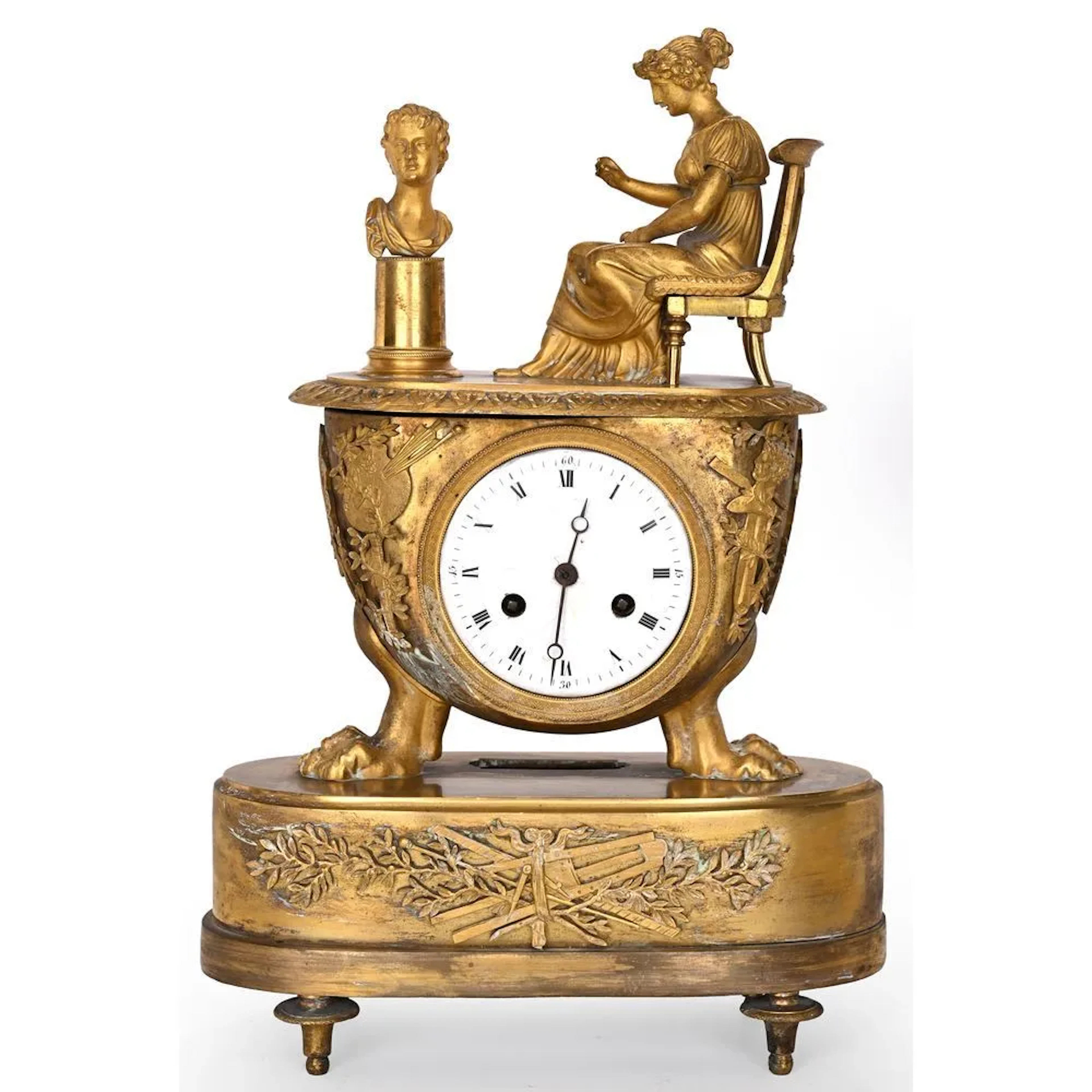 EMPIRE CLOCK in gilded bronze depicting a woman in classical style