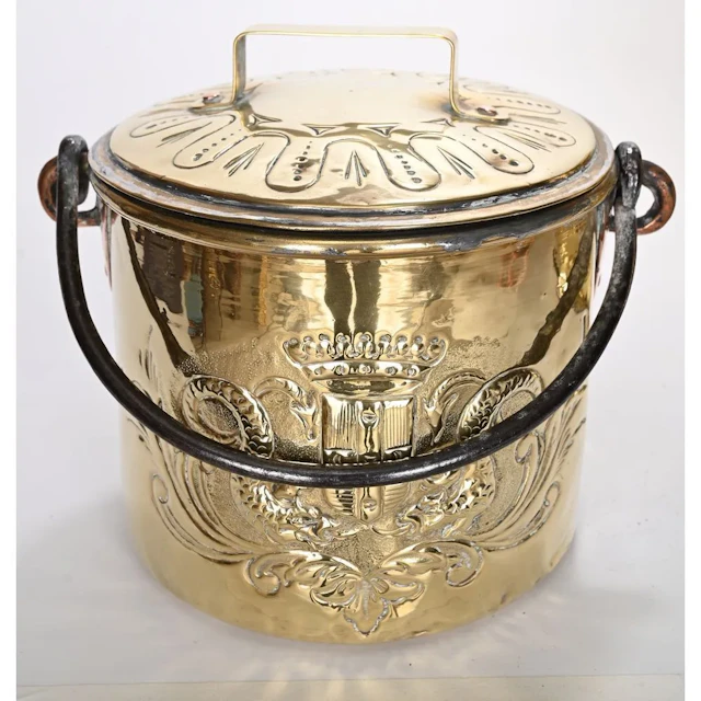Chiseled yellow copper cauldron decorated with fantastical animals