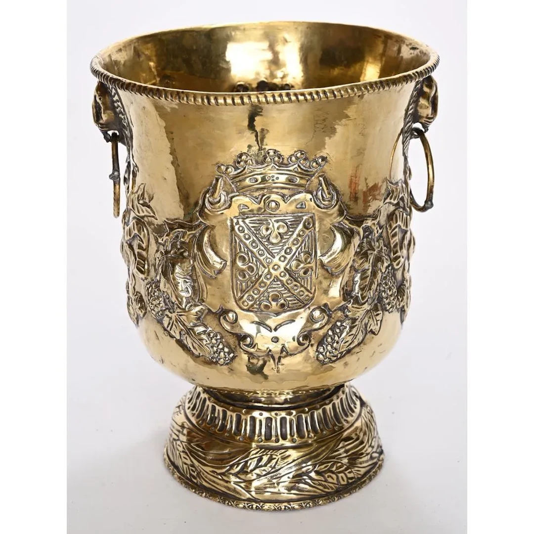 Yellow copper cooling bucket decorated with ribbon bows and pompons