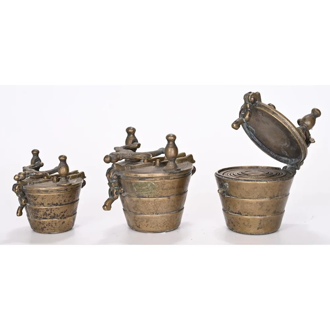 3 bronze CHARLEMAGNE WEIGHT STACKS with their interiors. 18th–19th