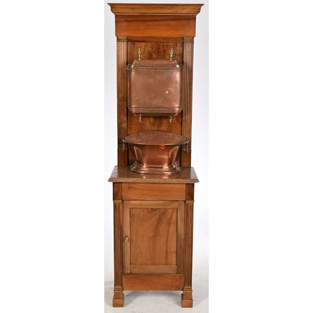 Copper FOUNTAIN with its basin, mounted on a walnut display stand.