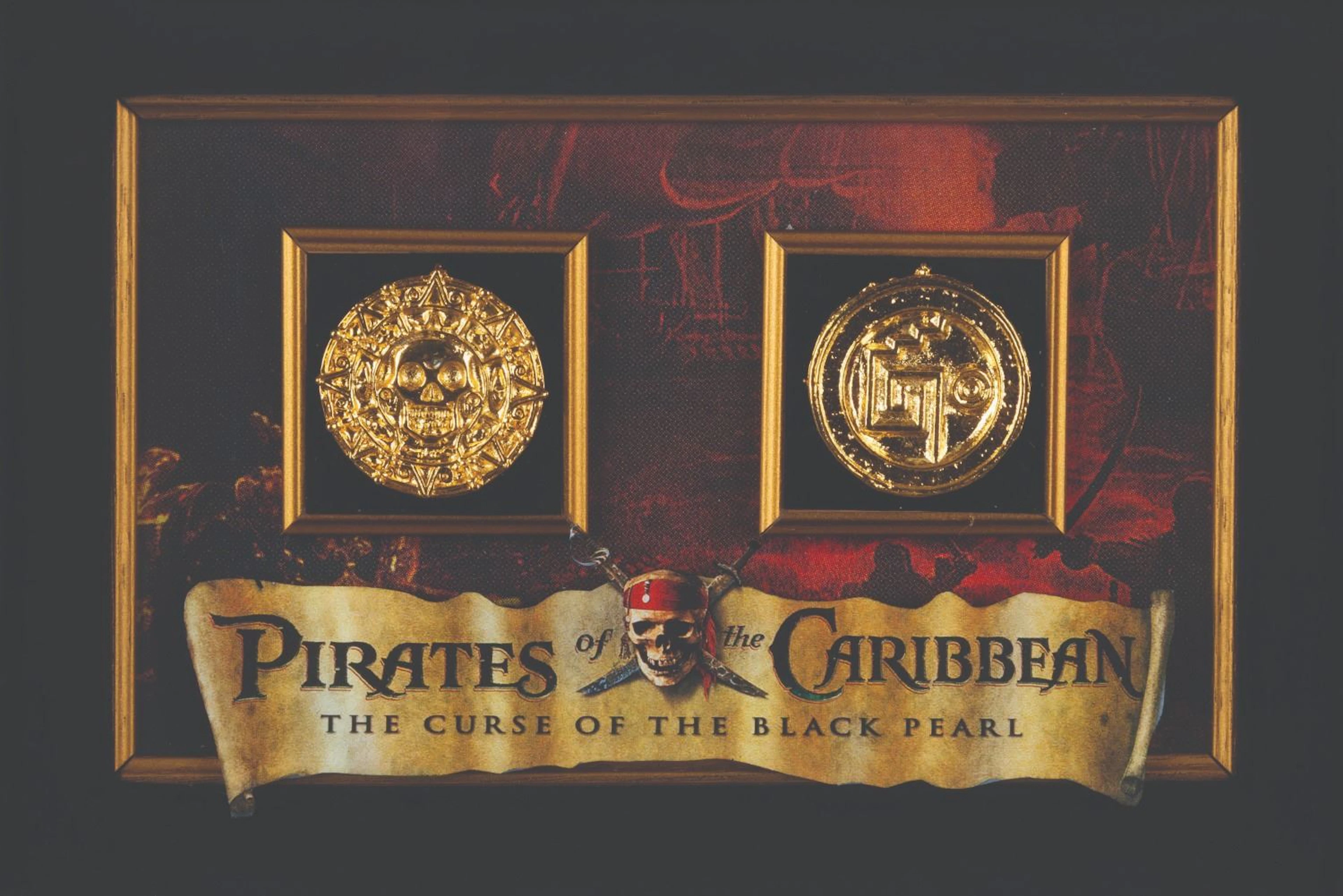 A Framed Pair of "Pirates of the Caribbean" Prop Coins.