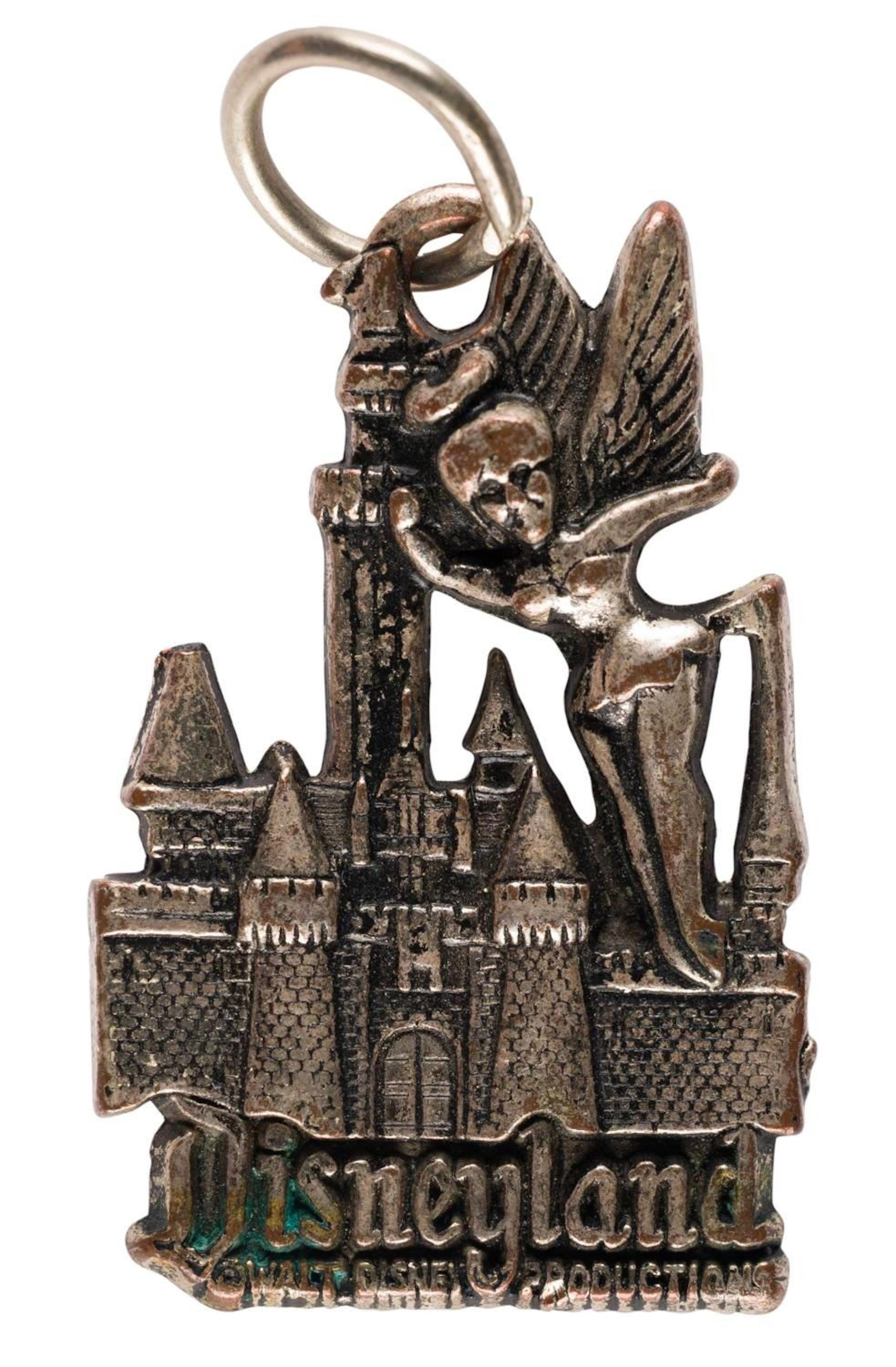 A Disneyland Tinker Bell and Sleeping Beauty Castle Charm.