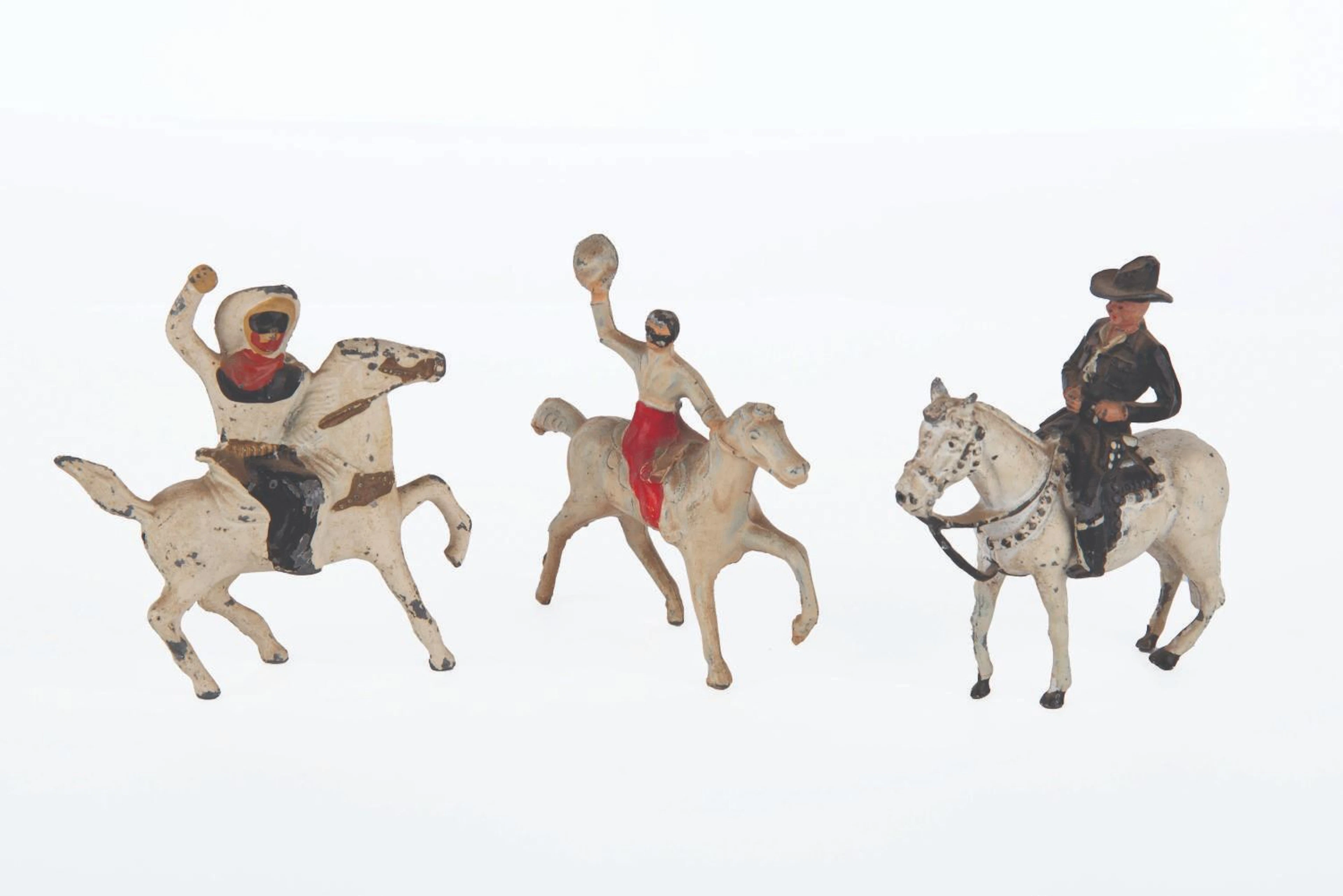 A Set of Lone Ranger & Hopalong Cassidy Metal Figures.