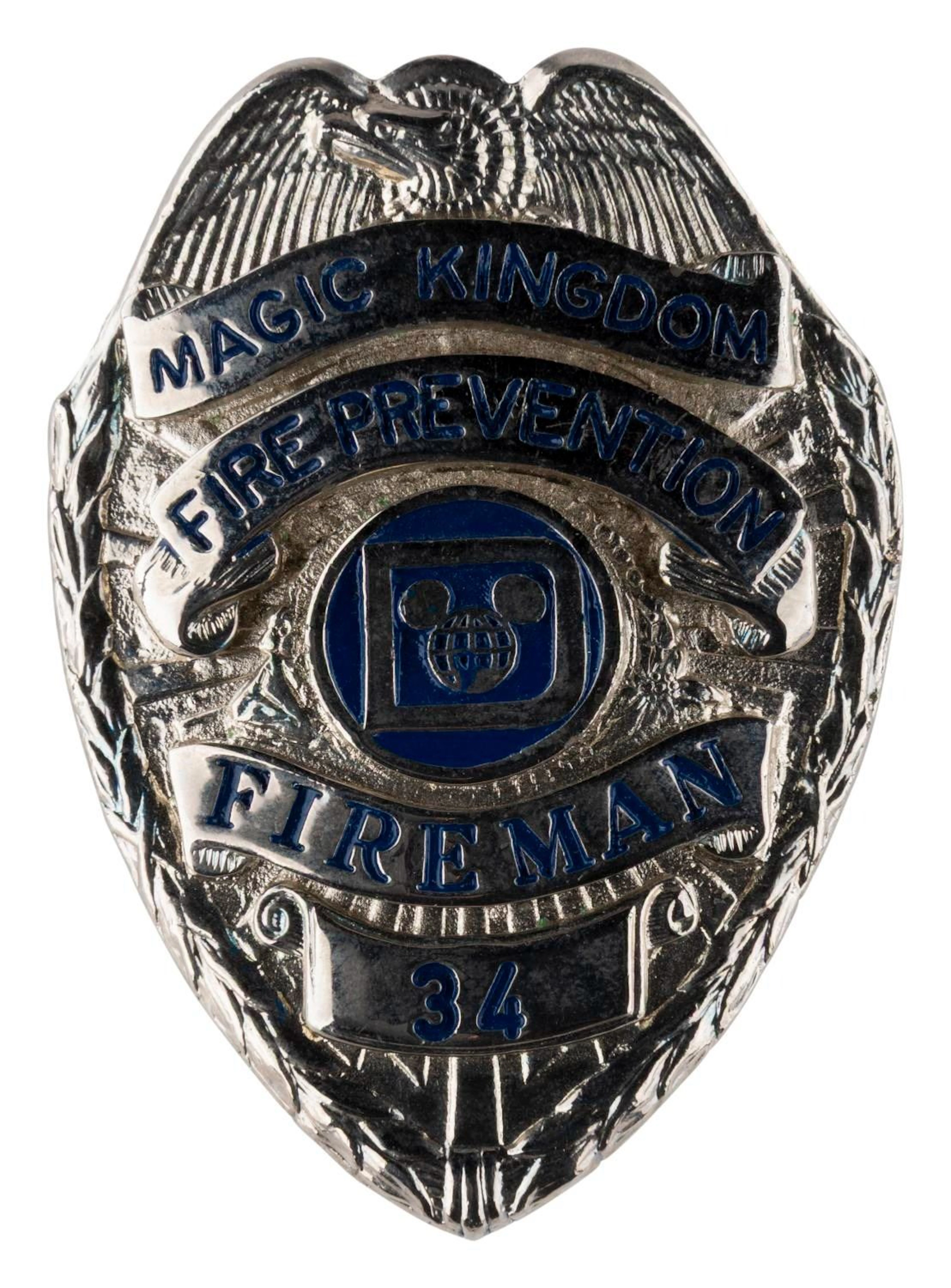 A Magic Kingdom Fireman Badge.