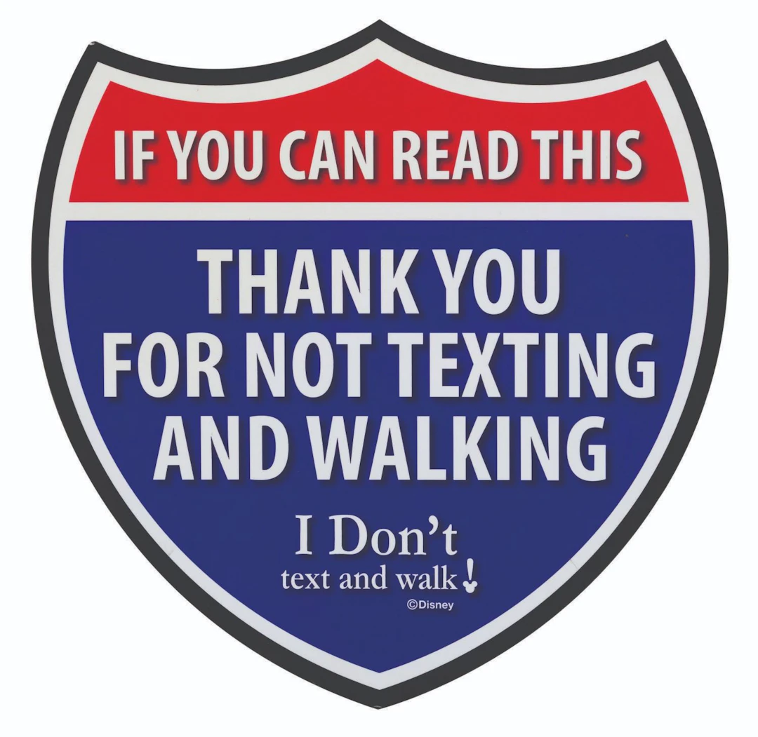 An “I Don’t Text and Walk” Backstage Cast Member Sign.