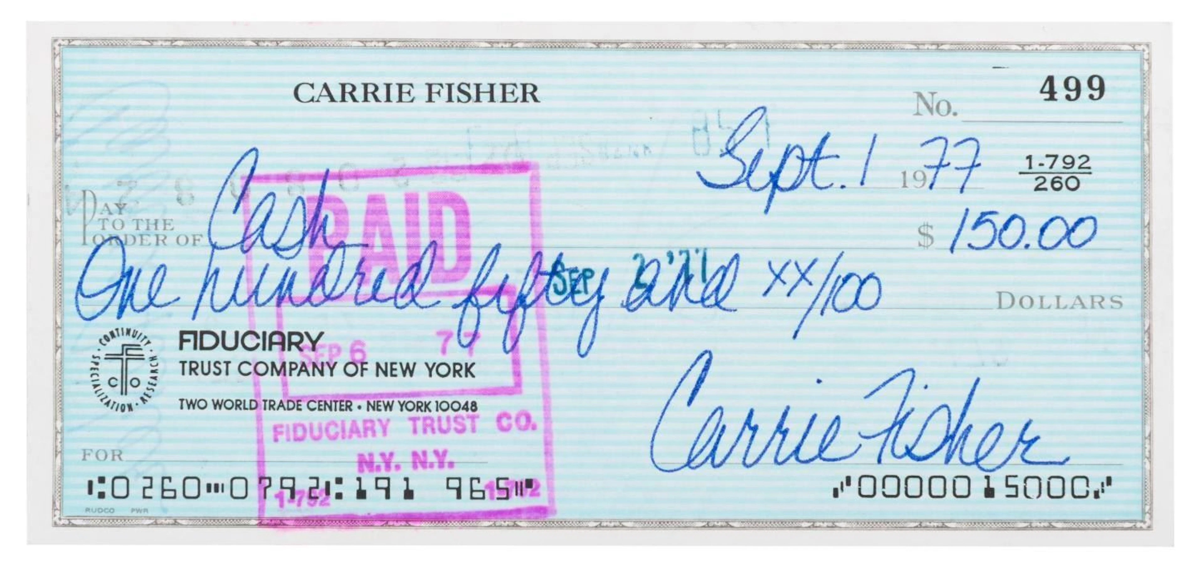 A Carrie Fisher Signed Check.