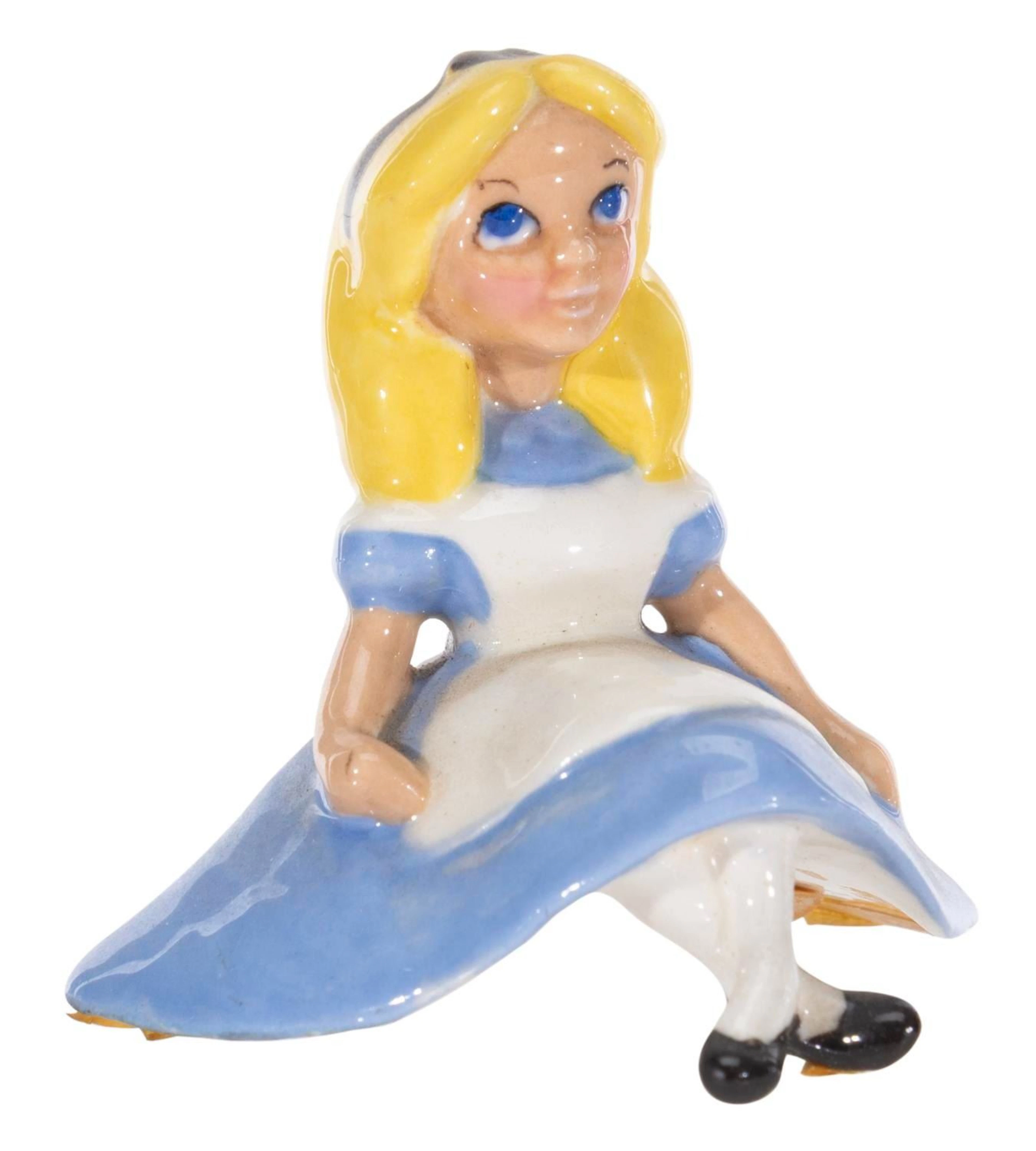 An"Alice in Wonderland" Figurine.
