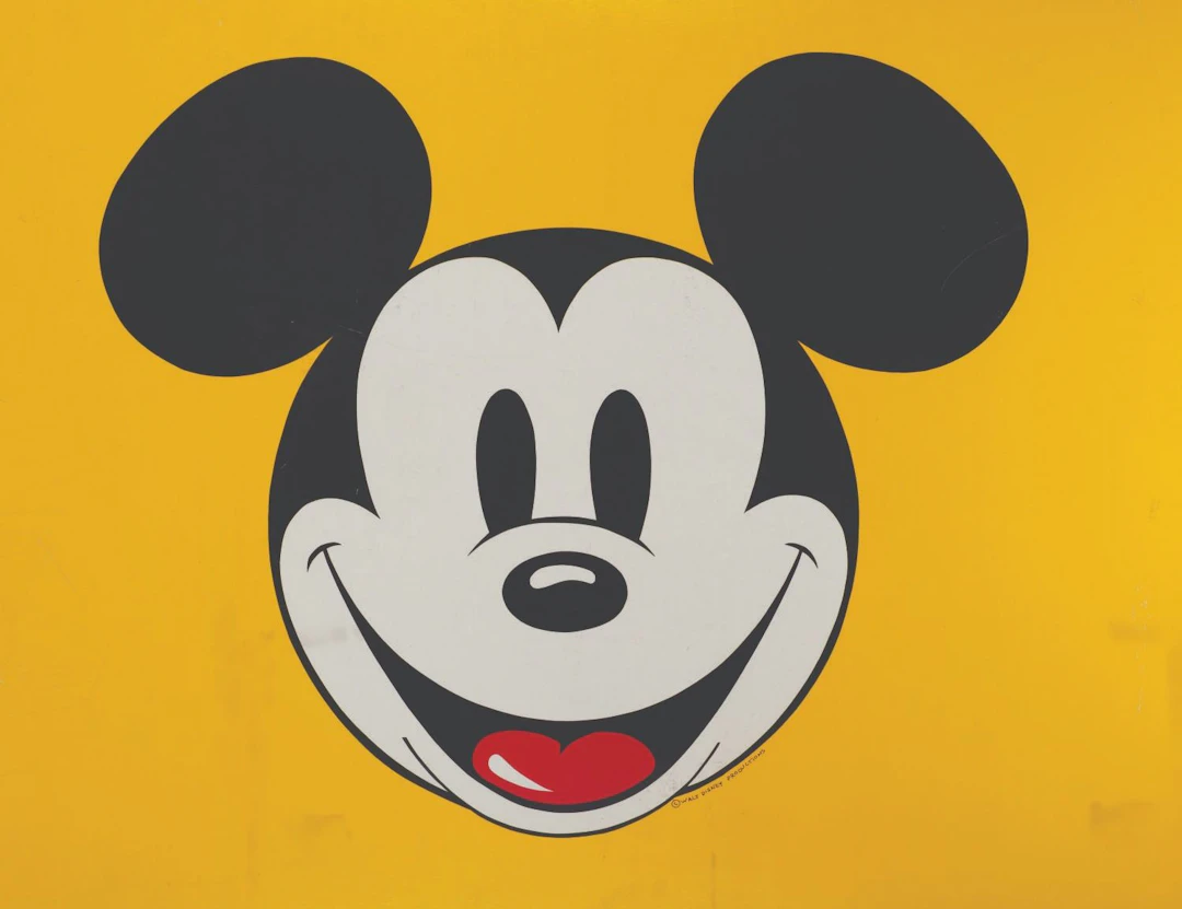 A Giant Double-Sided Mickey Smiling Sign.
