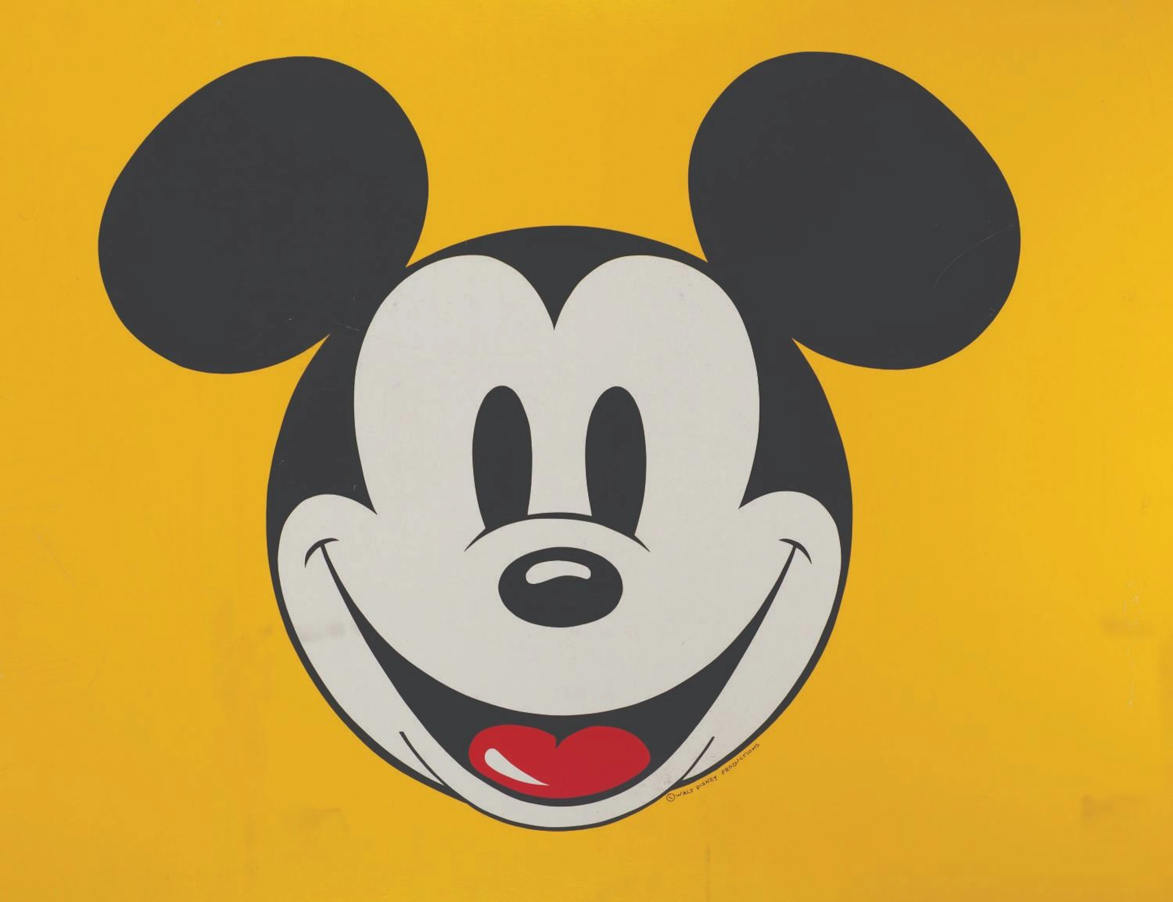 A Giant Double-Sided Mickey Smiling Sign.