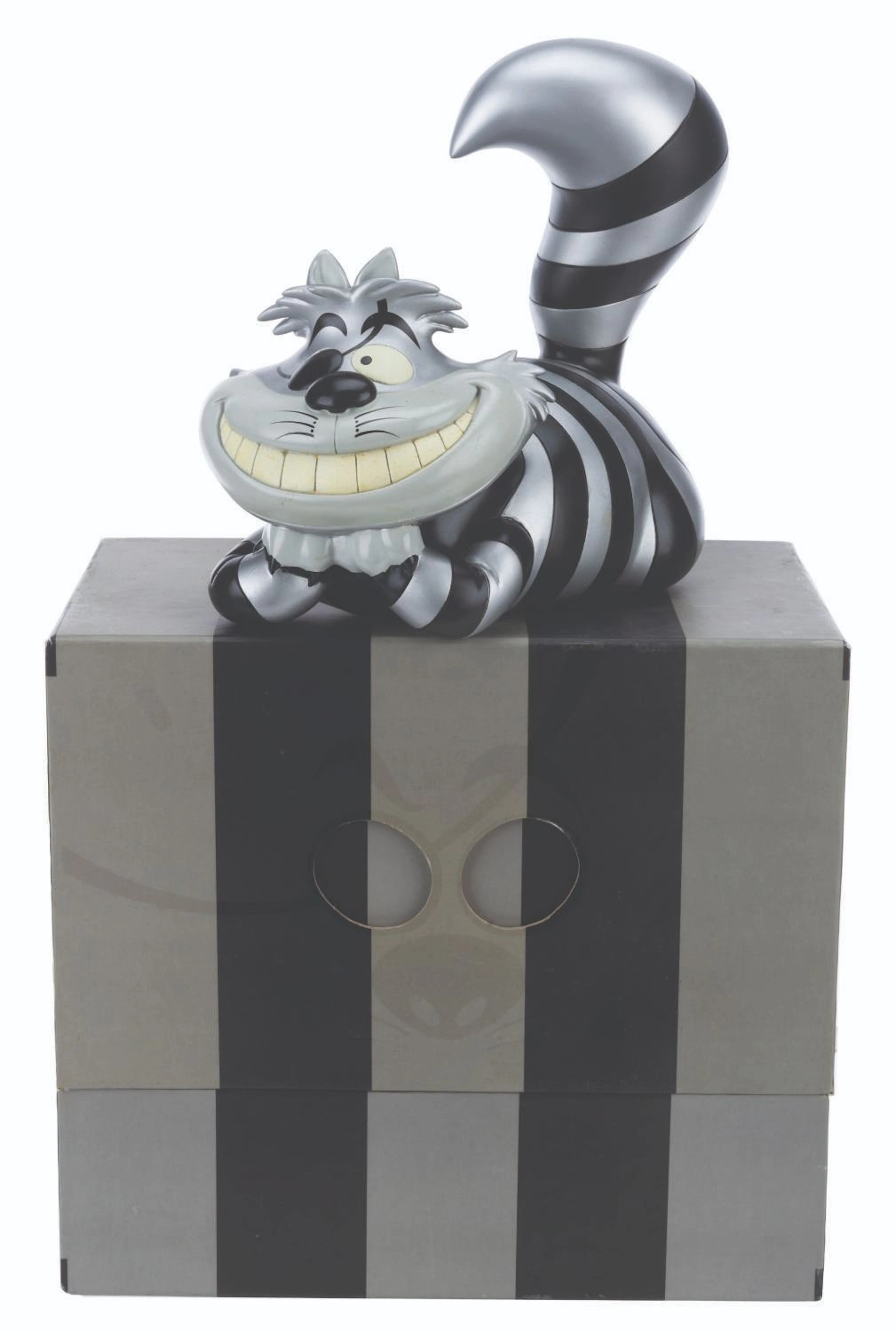 A Raiders Cheshire Cat Vinyl Figure.