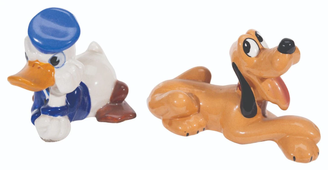 A Pair of Donald Duck and Pluto Ceramic Figurines.