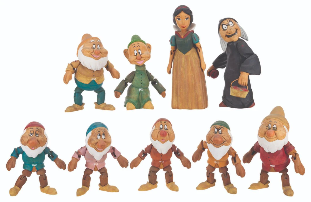 A Set of "Snow White and the Seven Dwarfs" Wooden Dolls.