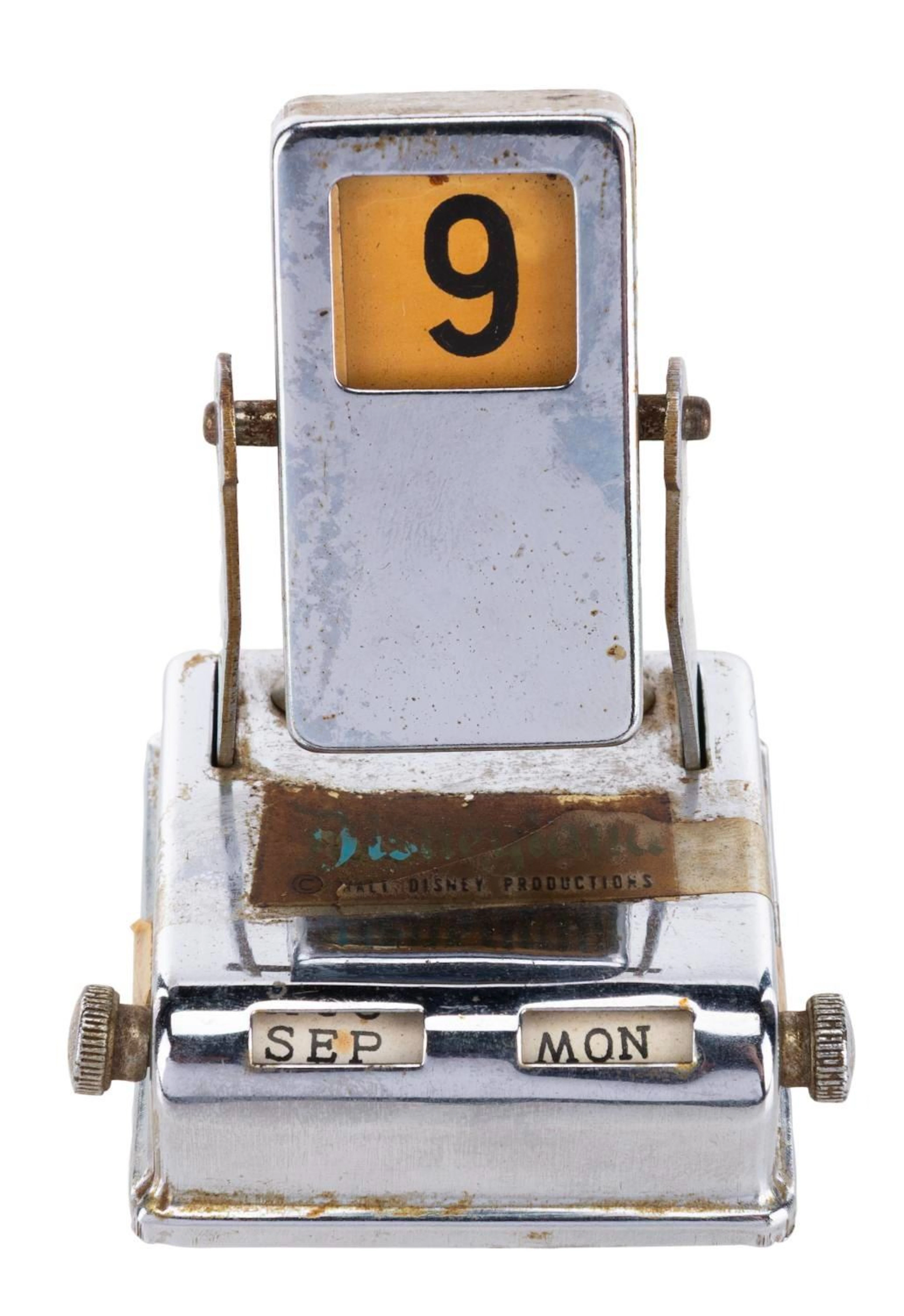 A Souvenir Perpetual Calendar with Disneyland Decal.
