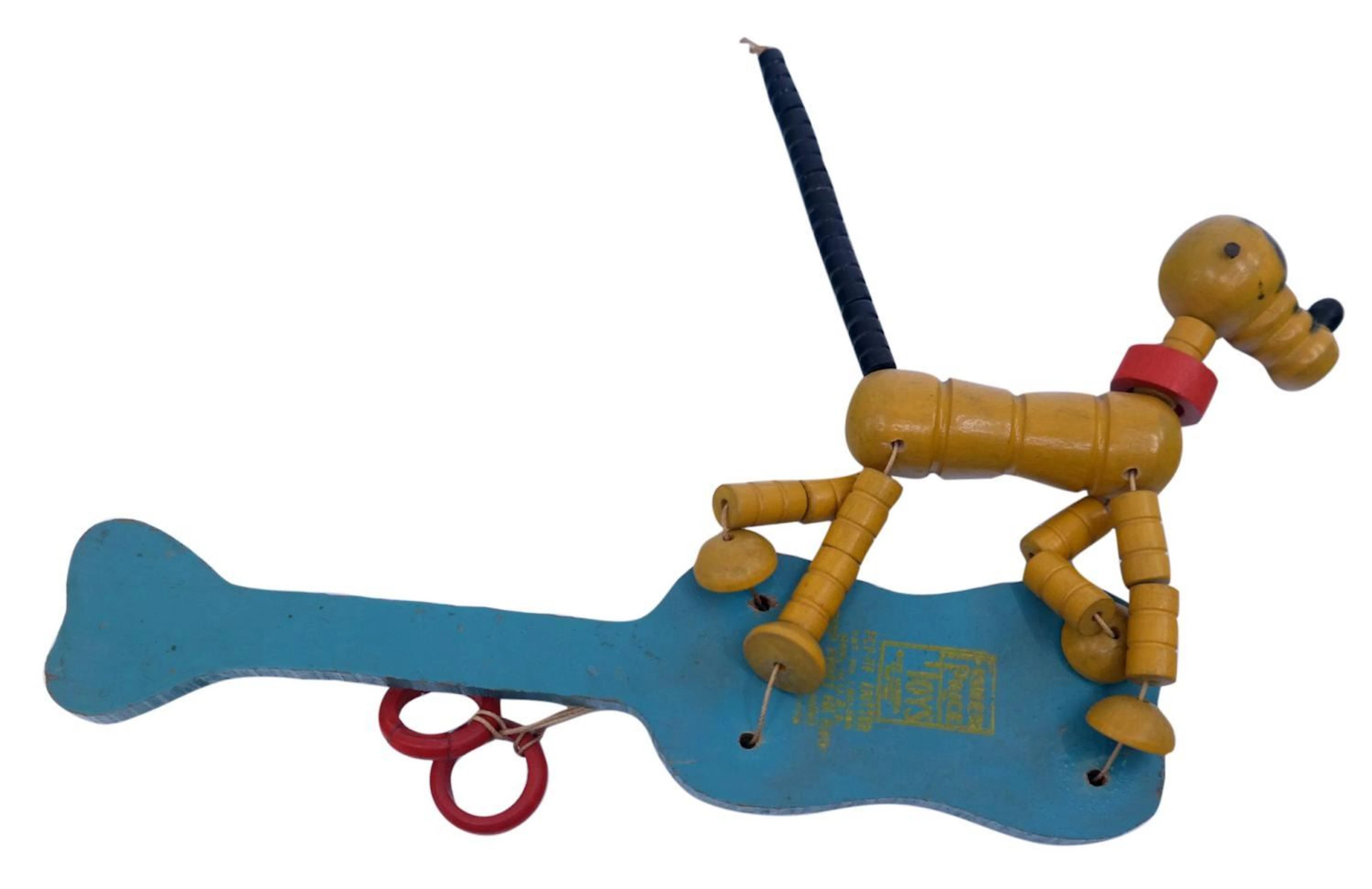 A Fisher Price Pop Up Kritter Pluto Toy.