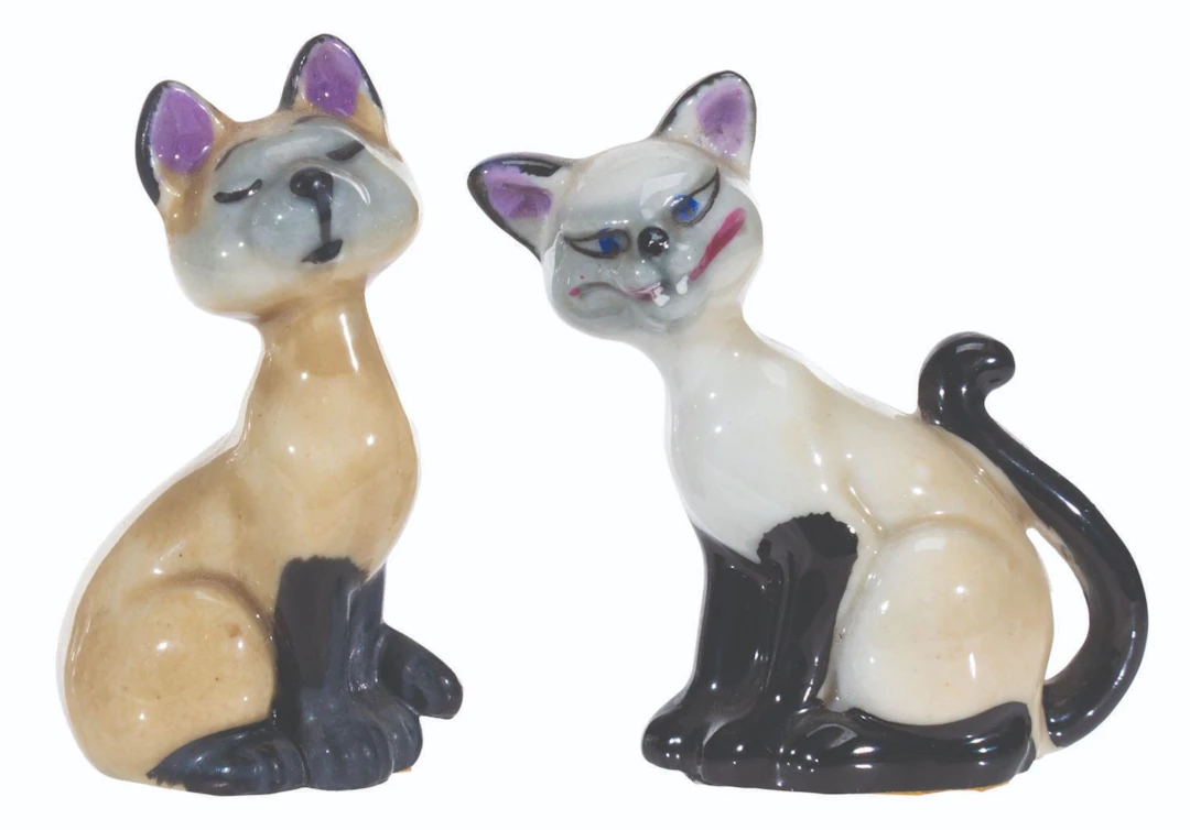 A Pair of "Lady and the Tramp" Si and Am Figurines.