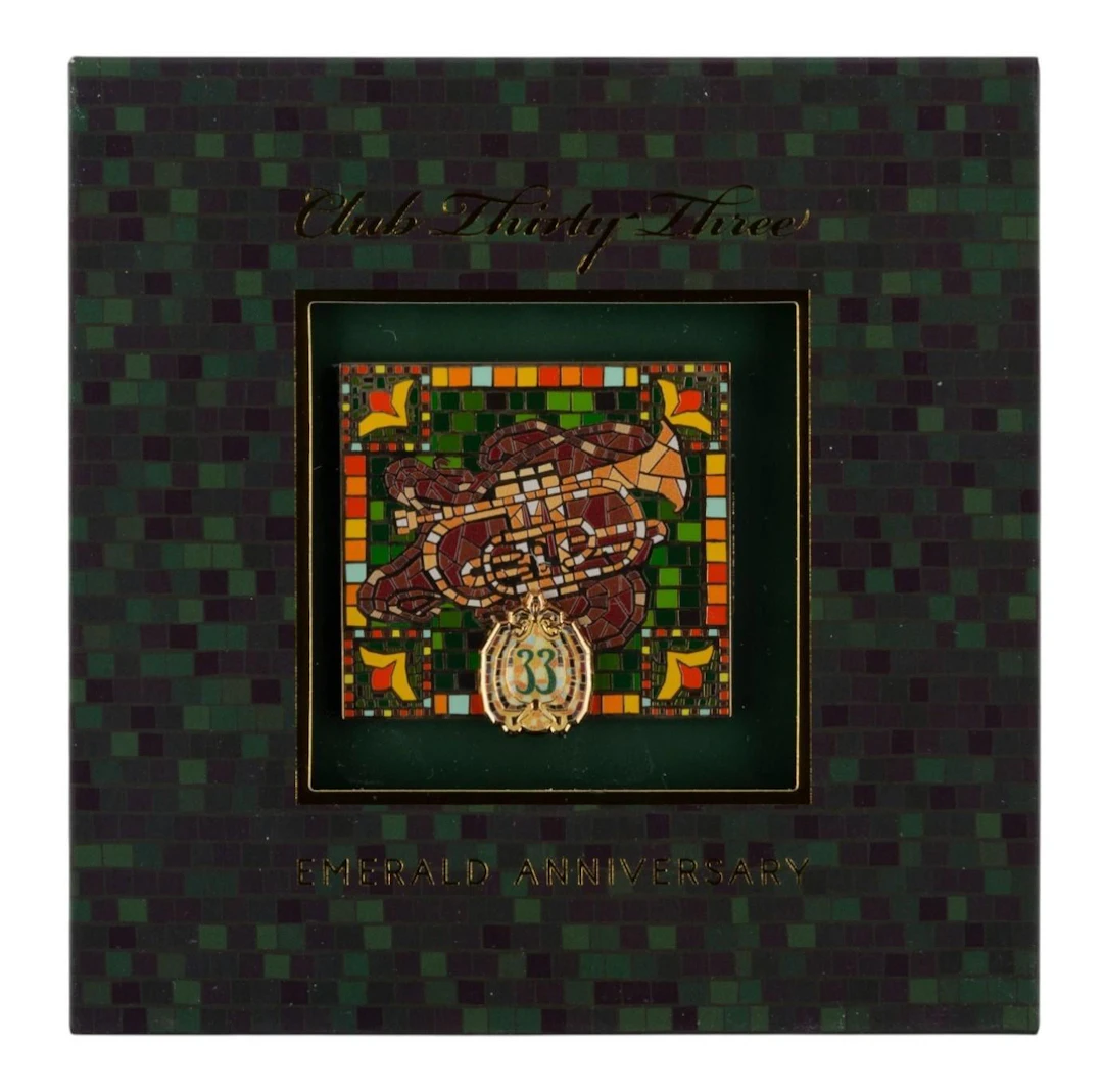 A Club 33 Commemorative Emerald Anniversary Trumpet Pin.