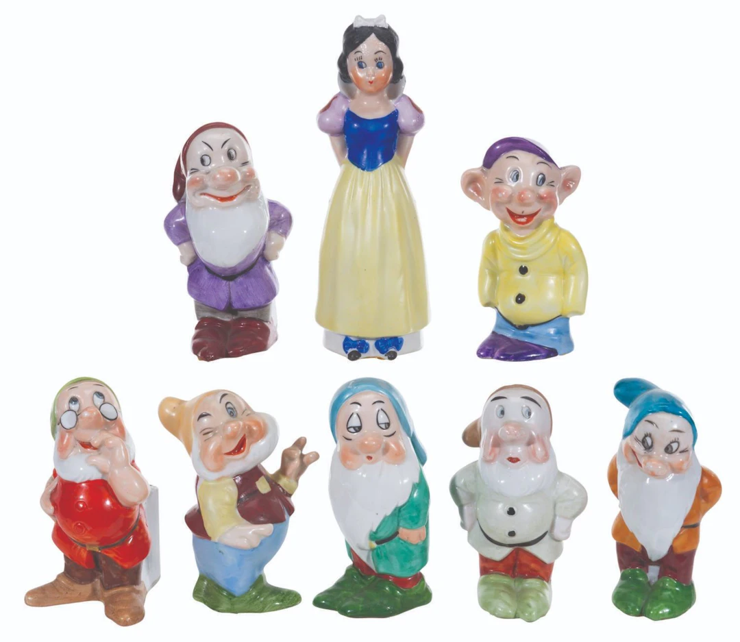 A Set of Maw "Snow White and the Seven Dwarfs" Toothbrush Holders.