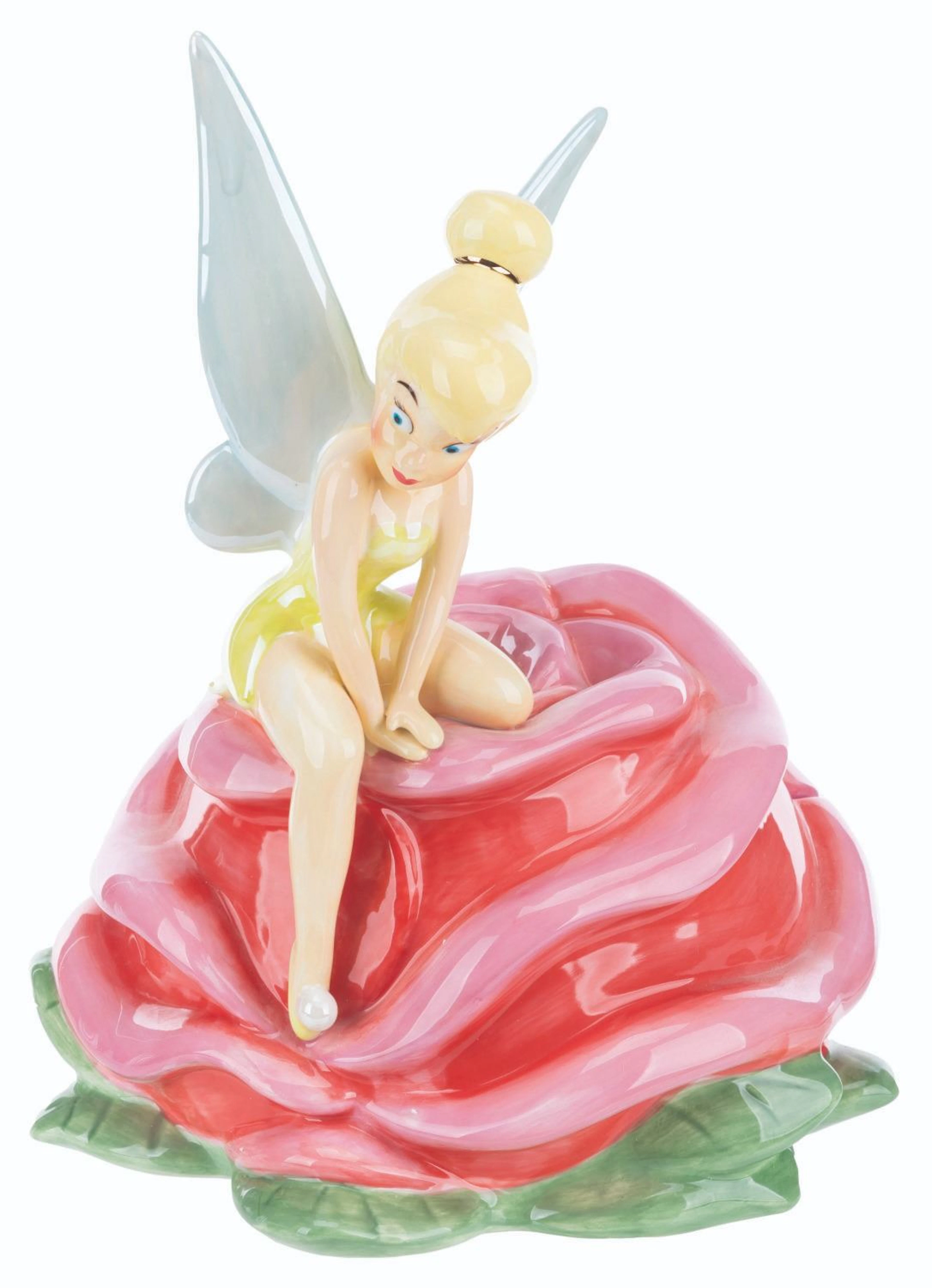 A Tinker Bell on a Rose Cookie Jar.