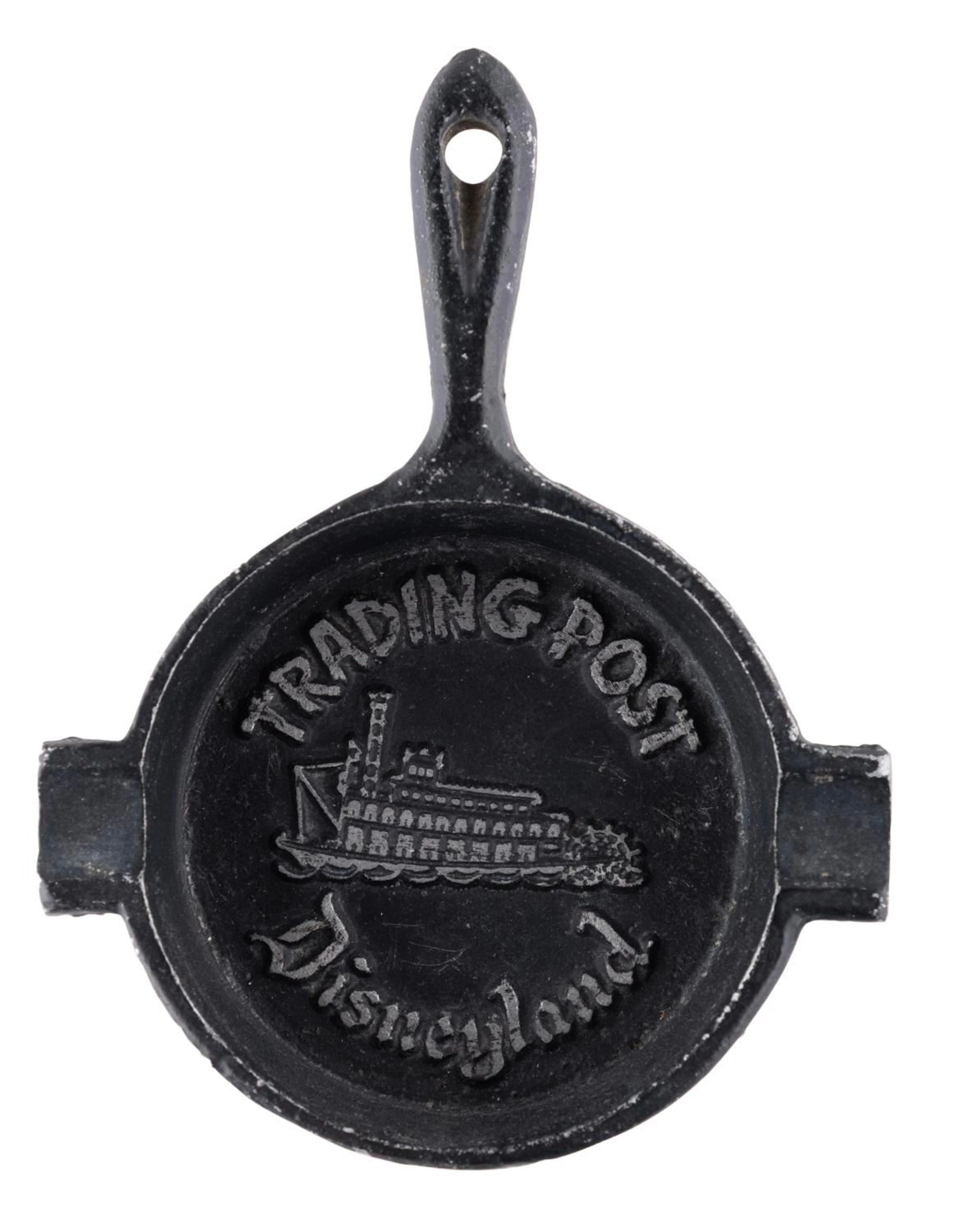 A Cast Iron Disneyland Trading Post Ashtray.